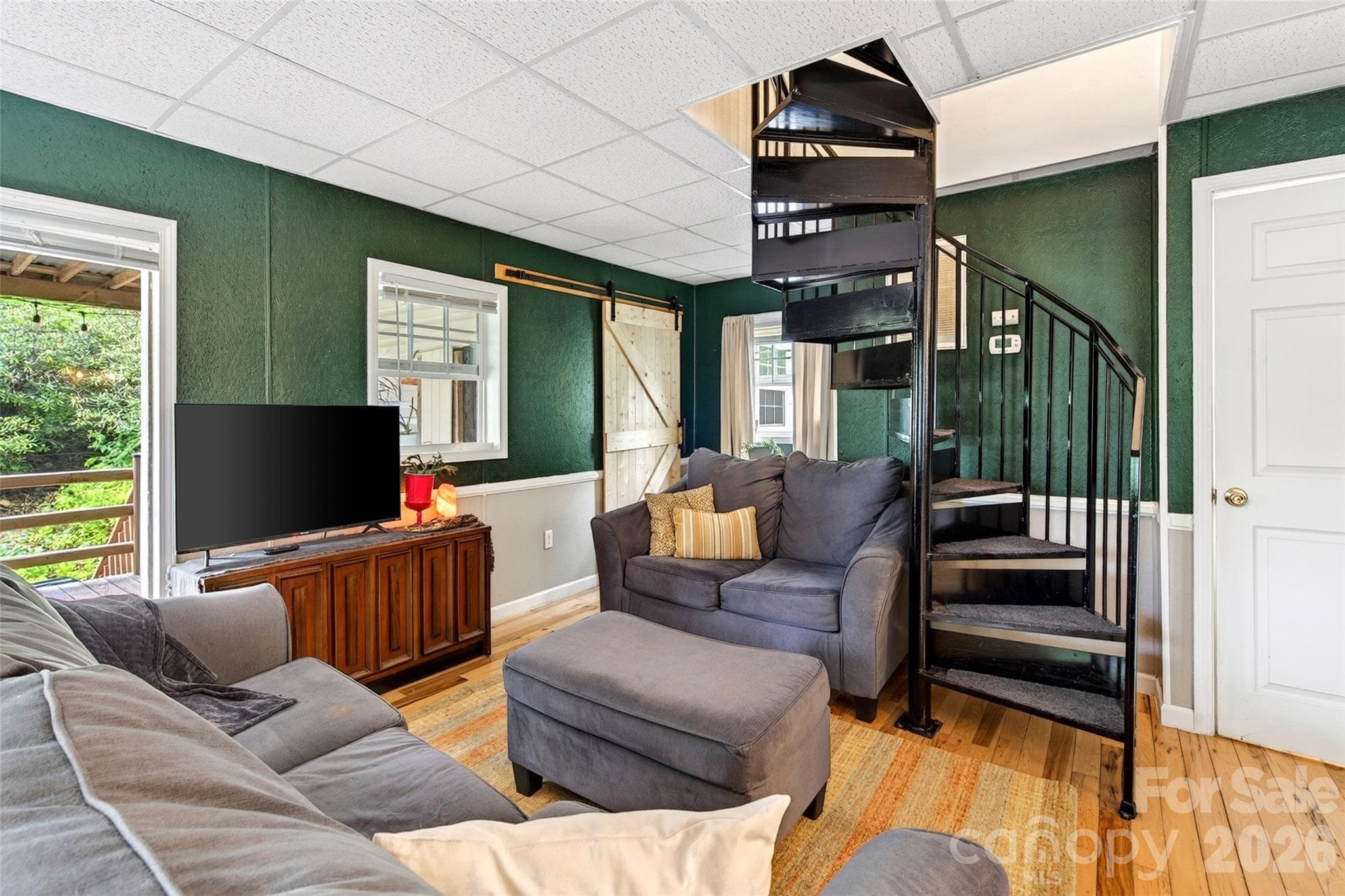 Spiral staircase is a statement in the main living room. - 227 Locust Cove Road, Marion