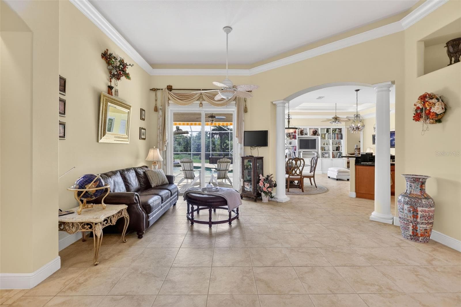 Designed for both everyday living and entertaining, the spacious layout offers seamless transitions between the formal living areas, kitchen, and outdoor spaces. - 1210 408TH CT E, MYAKKA CITY