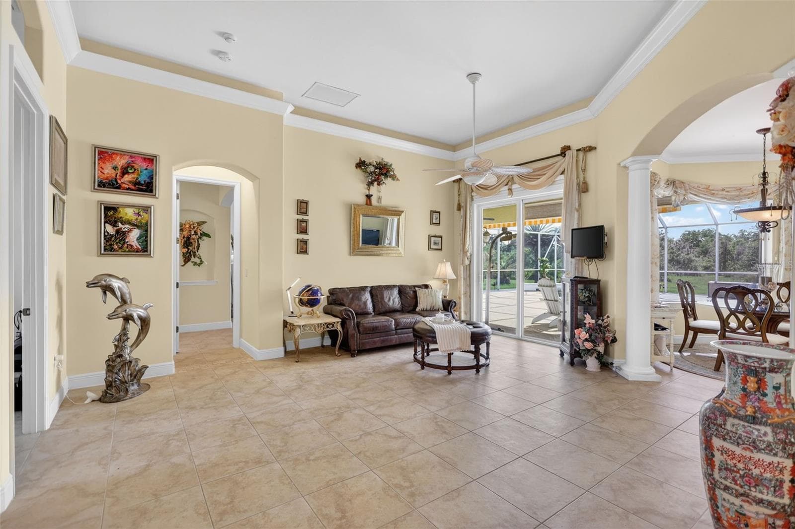 The thoughtfully designed floor plan features elegant architectural elements, abundant natural light, and direct access to the resort-style outdoor living areas. - 1210 408TH CT E, MYAKKA CITY