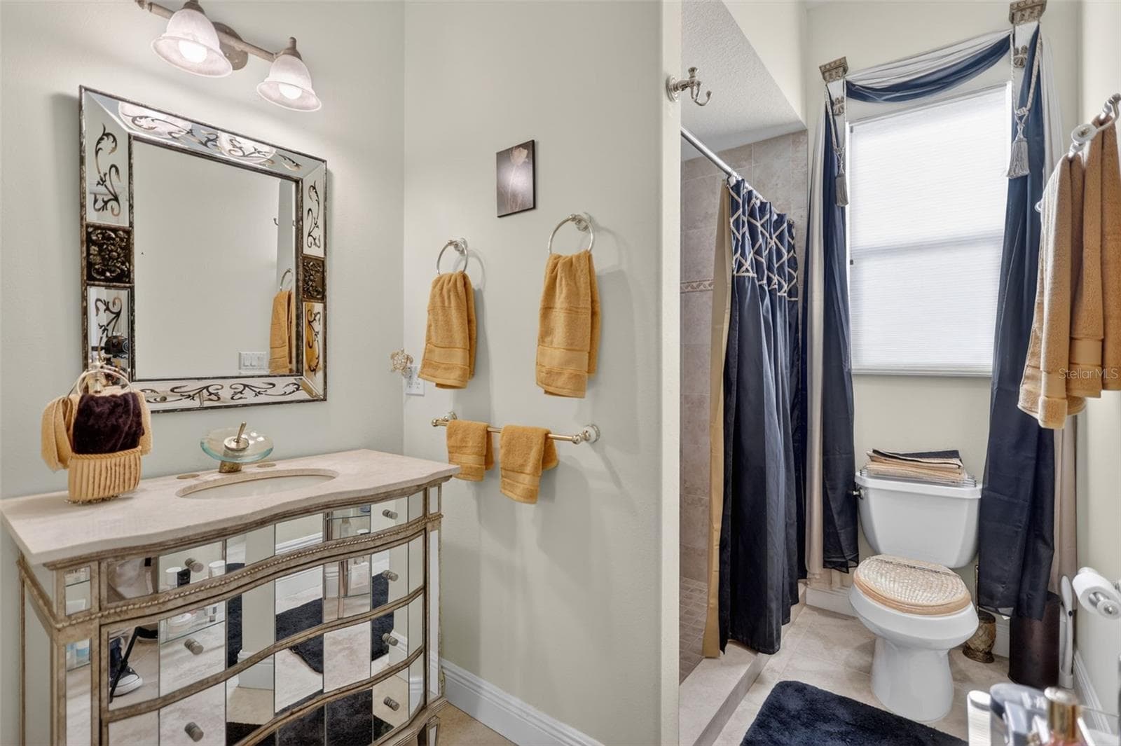Conveniently positioned for guests and outdoor entertaining, the pool bath offers easy access from the lanai while maintaining privacy and comfort. - 1210 408TH CT E, MYAKKA CITY