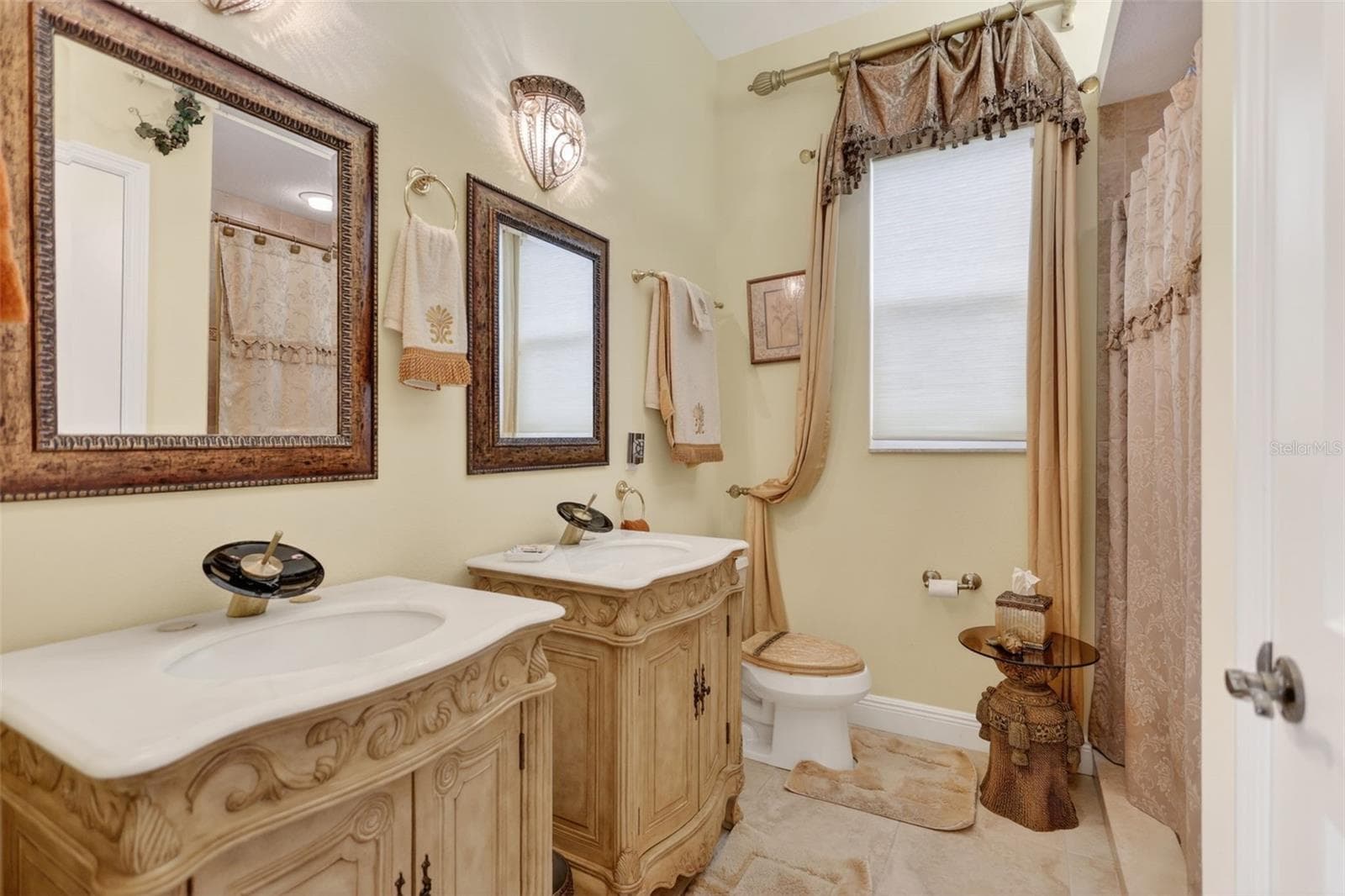 Elegant fixtures and quality finishes create a welcoming guest bath designed with both style and practicality in mind. - 1210 408TH CT E, MYAKKA CITY
