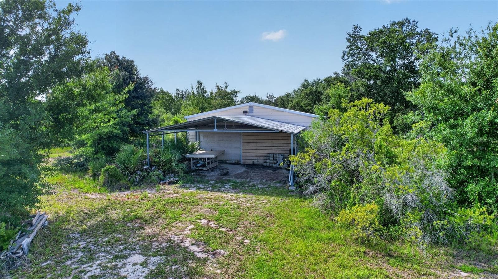 The Workshop features water, electric and a covered parking carport area for all your outdoor toys. - 1210 408TH CT E, MYAKKA CITY