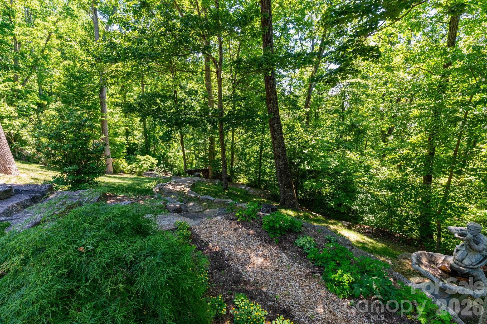 Tucked into the trees, this private retreat blends timeless craftsmanship with serene mountain living. - 29 Gardner Drive, Asheville