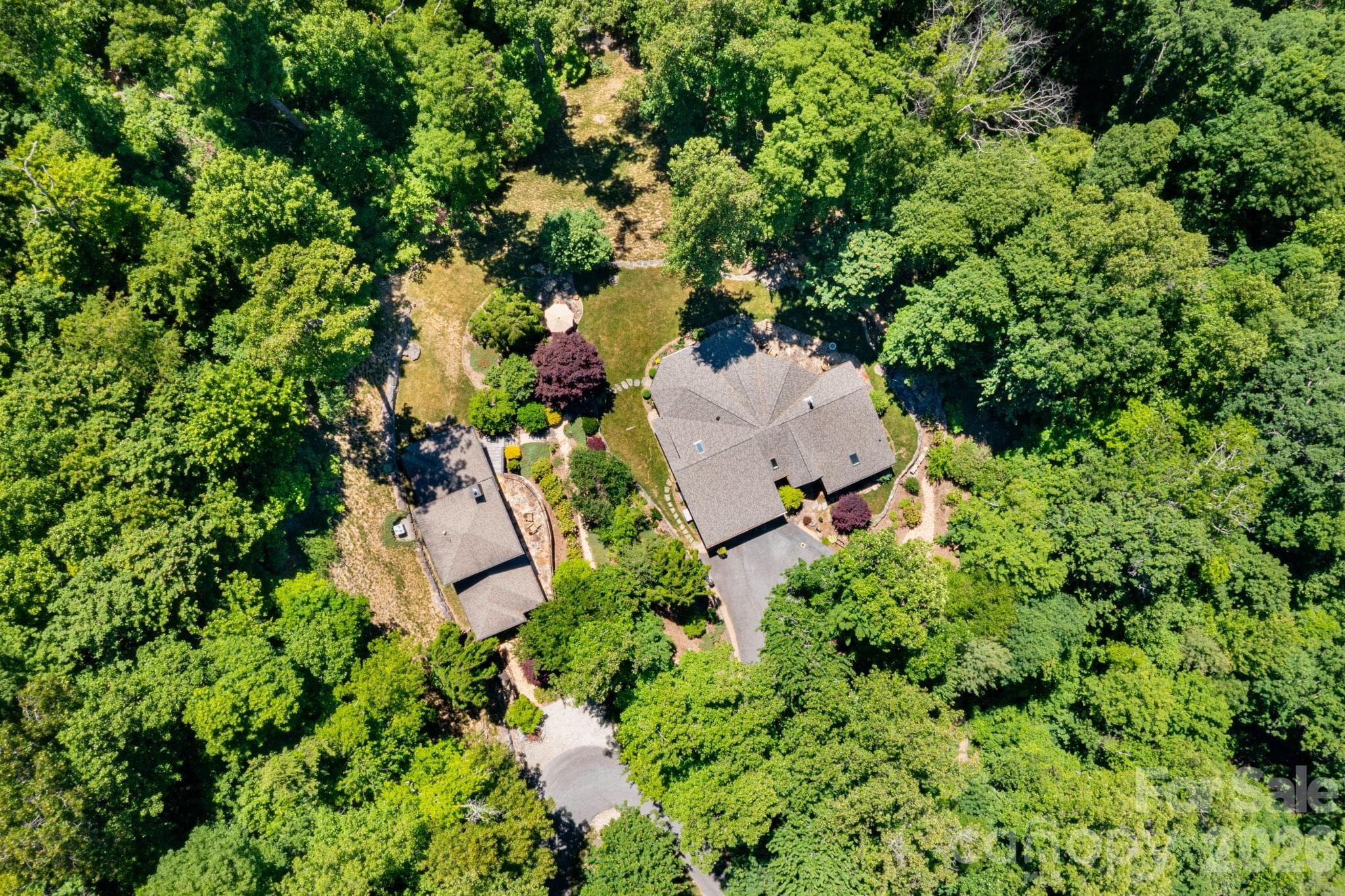 Guest House. Aerial views showcase the remarkable privacy, surrounding mountain landscape, and unique estate setting. - 29 Gardner Drive, Asheville