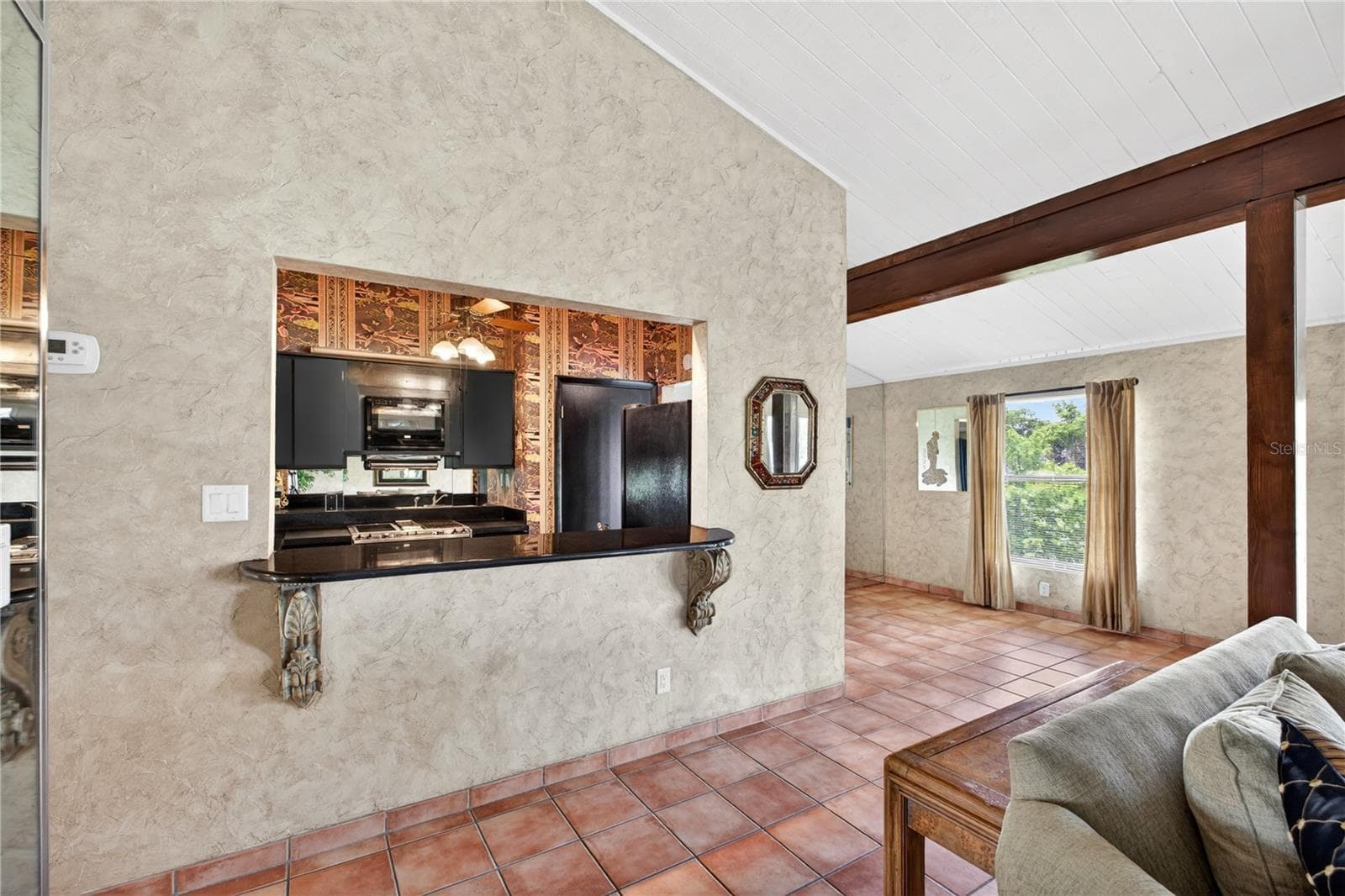 Breakfast bar/pass through to the living room. - 200 MAITLAND AVE #128, ALTAMONTE SPRINGS