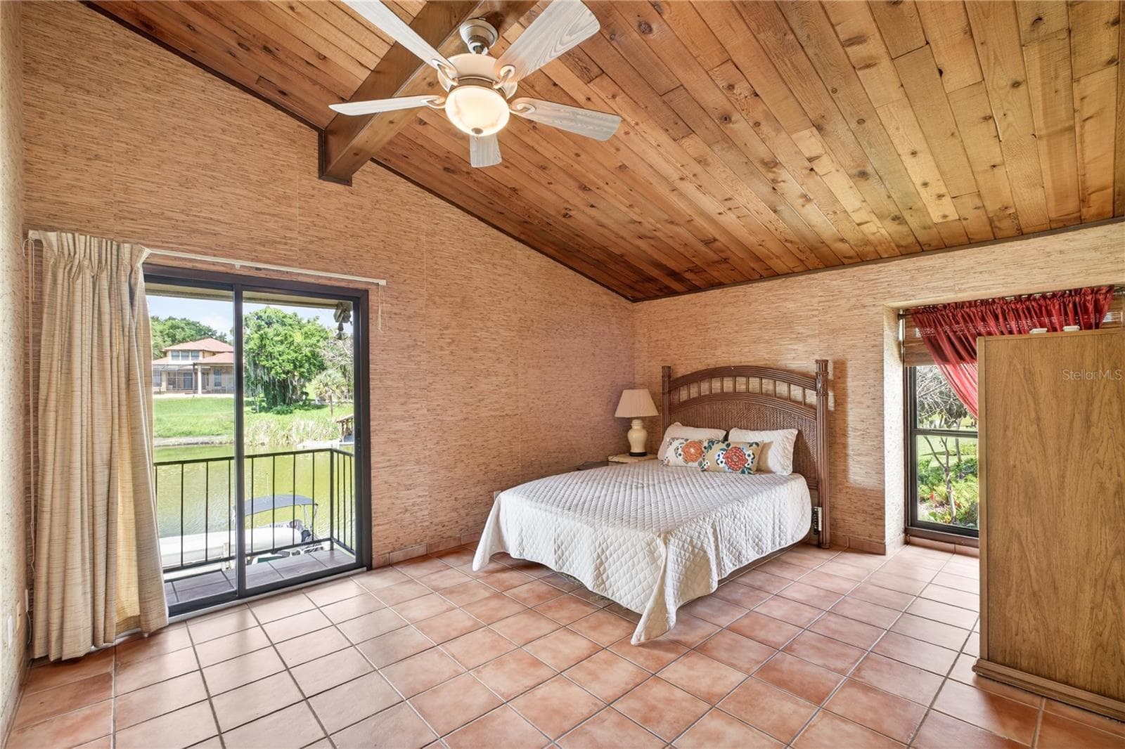 Primary ensuite with balcony overlooking the lake. - 200 MAITLAND AVE #128, ALTAMONTE SPRINGS