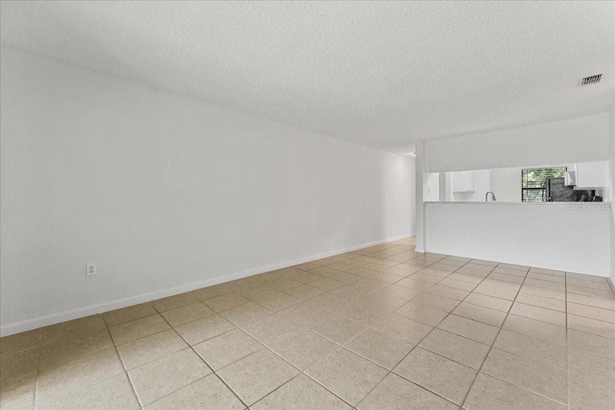 Living Room back towards kitchen - 3001 58TH AVE S #1106, ST PETERSBURG