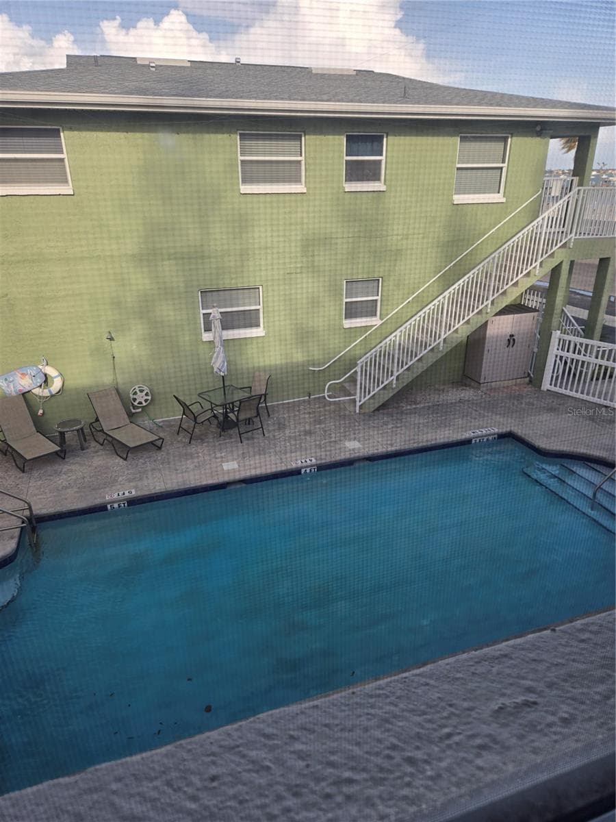 VIEW OUT GUEST BEDROOM WINDOW - 5605 SHORE BLVD S #1B, GULFPORT