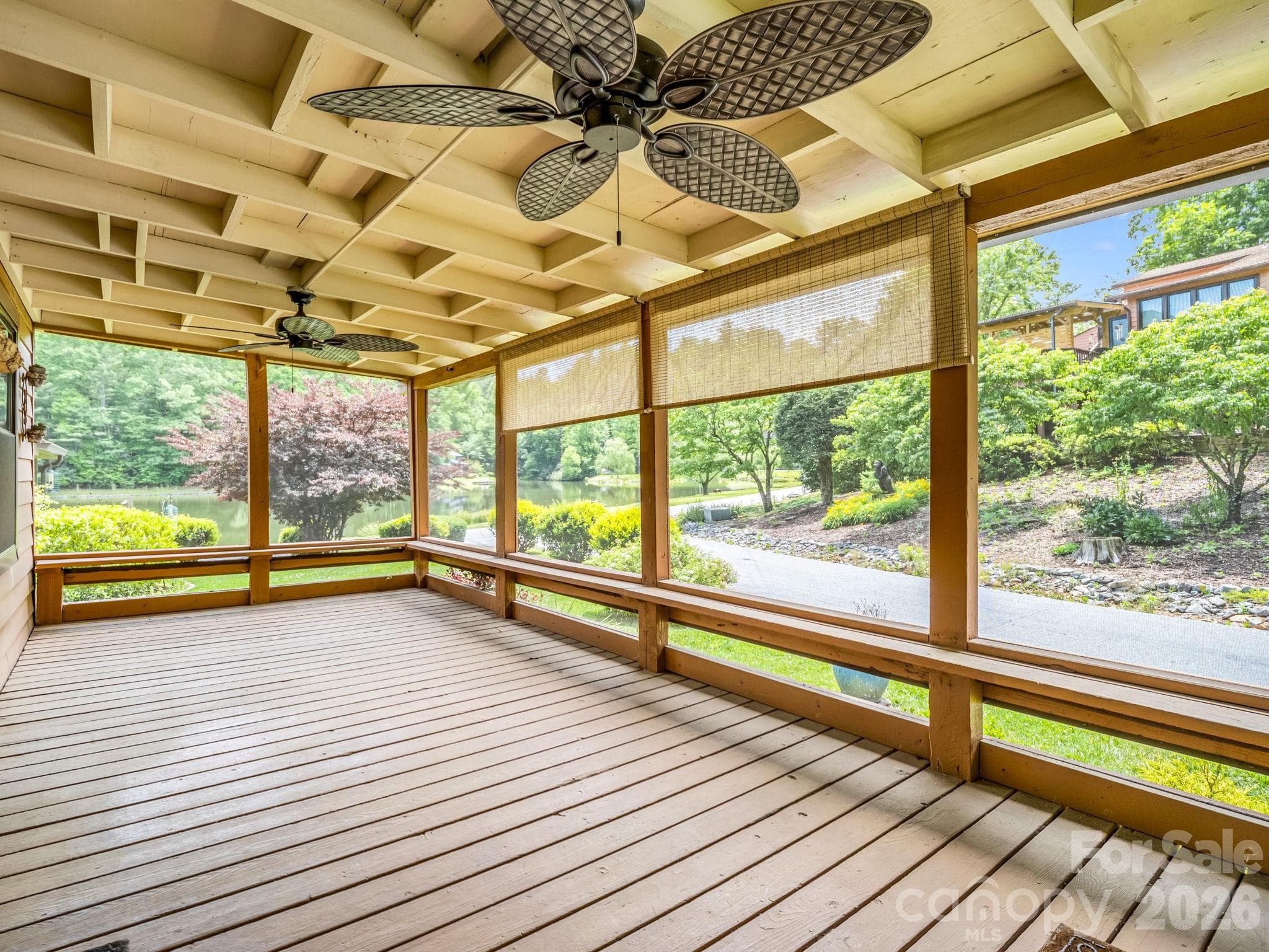 Screened in porch with fan.  Seller left the grill and propane tank that convey. - 117 Willow Way, Hendersonville