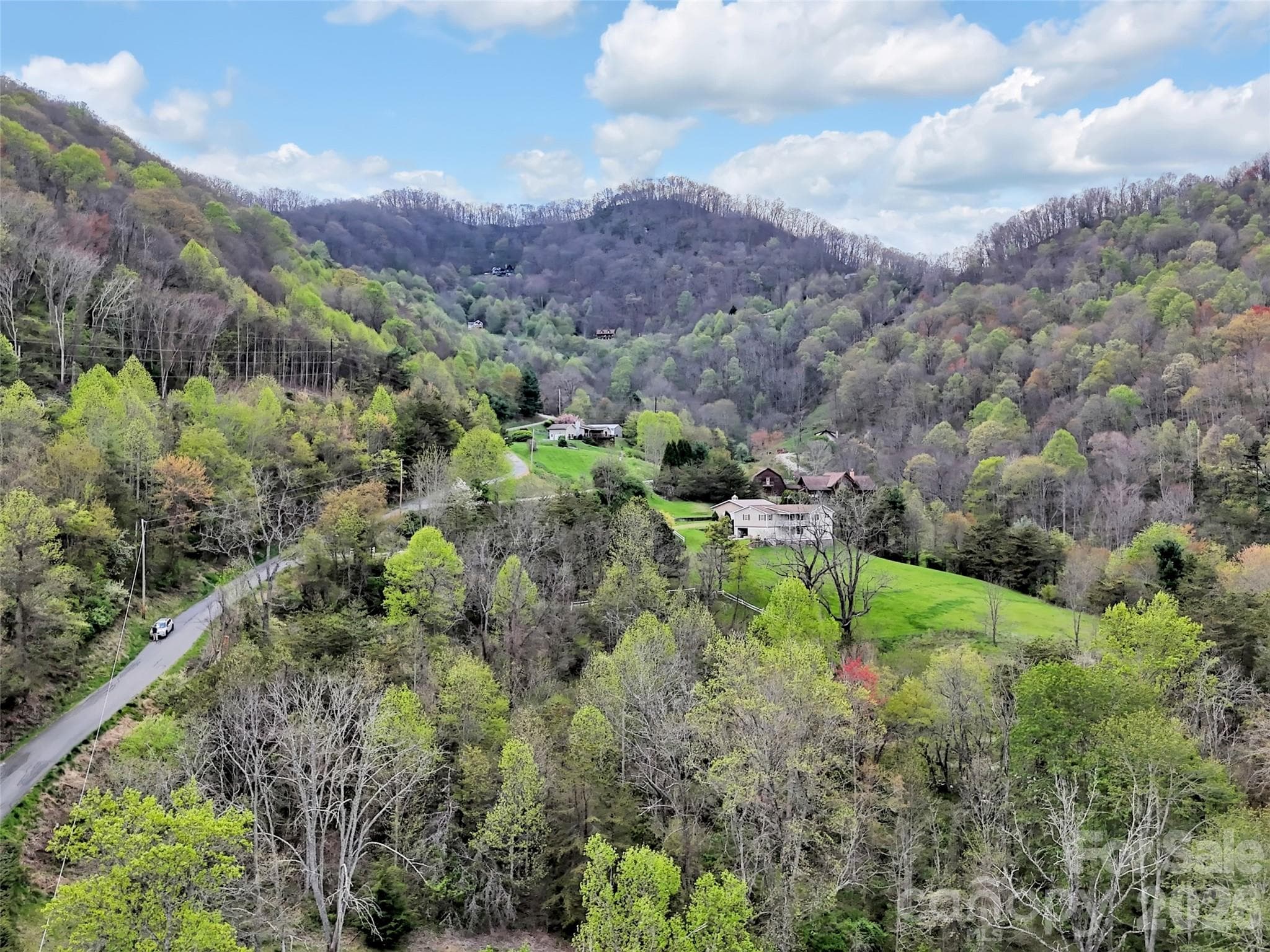 Closer aerial view looking into the property. - Waynesville