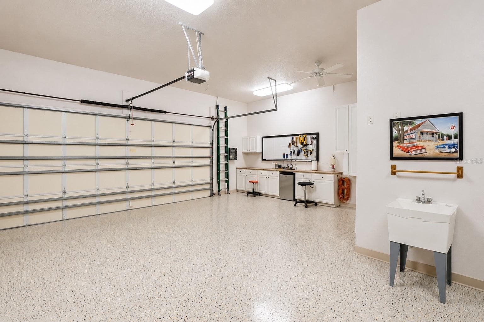 Virtually decluttered workshop area in garage - 2075 MUSTANG CT, ST CLOUD