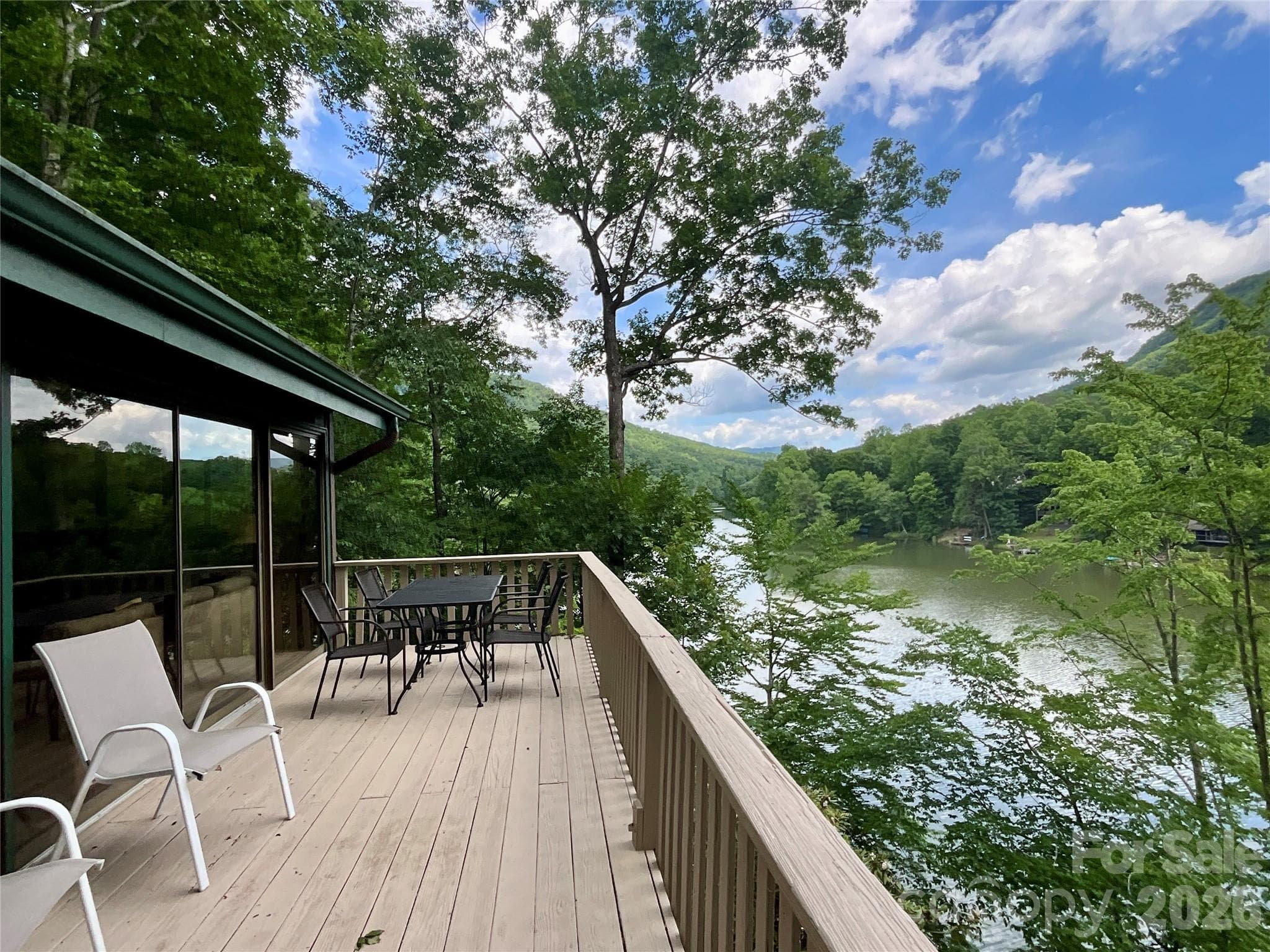 Peaceful year-round lake and mountain views create a beautiful backdrop for relaxing and enjoying the natural surroundings. - Lake Lure