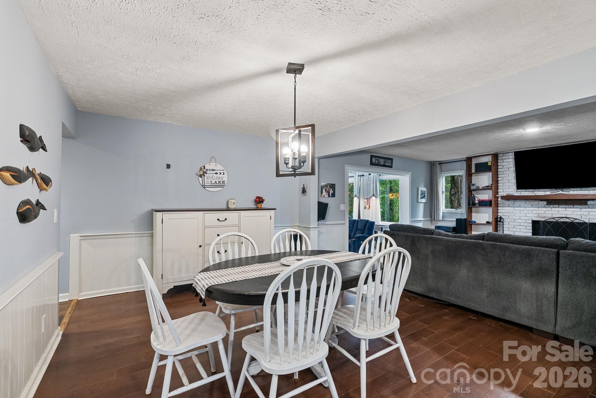 Just beyond this dining area lies the den and beyond that step down into the game room / sunroom. - 4 Beechwood Lakes Drive, Hendersonville