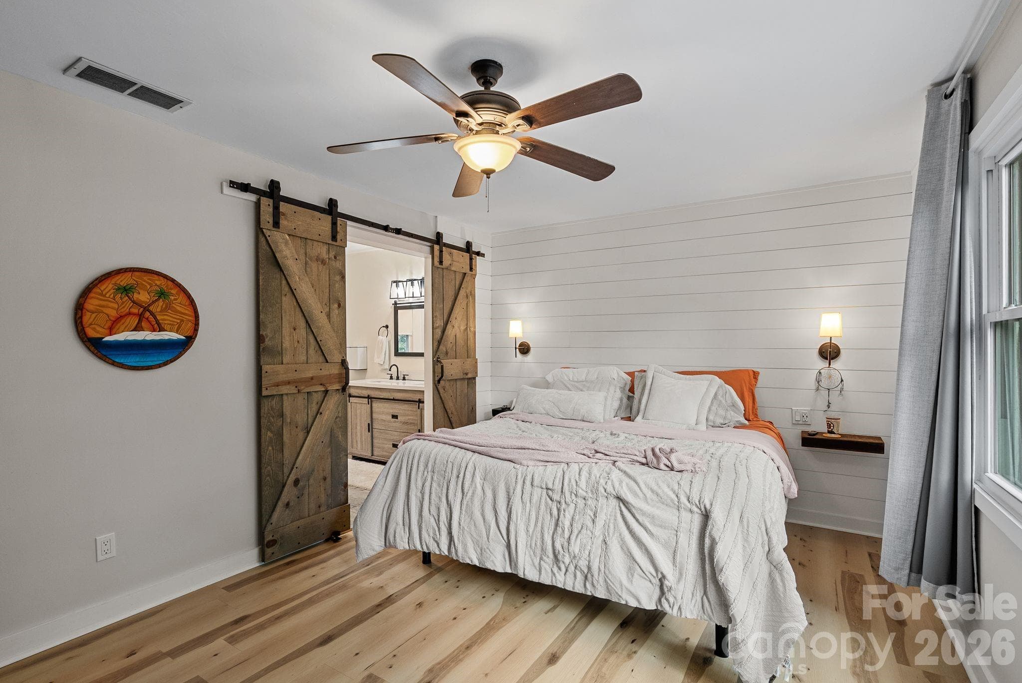 At the top of your stairs step into the owner's suite with charming large bedroom featuring shiplap wall. - 4 Beechwood Lakes Drive, Hendersonville