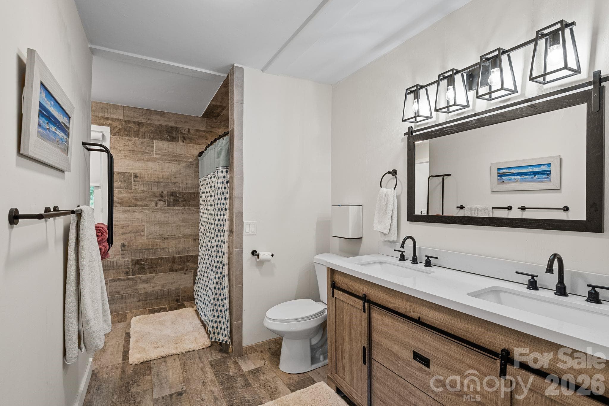 The primary bath features double sink and spa shower. - 4 Beechwood Lakes Drive, Hendersonville