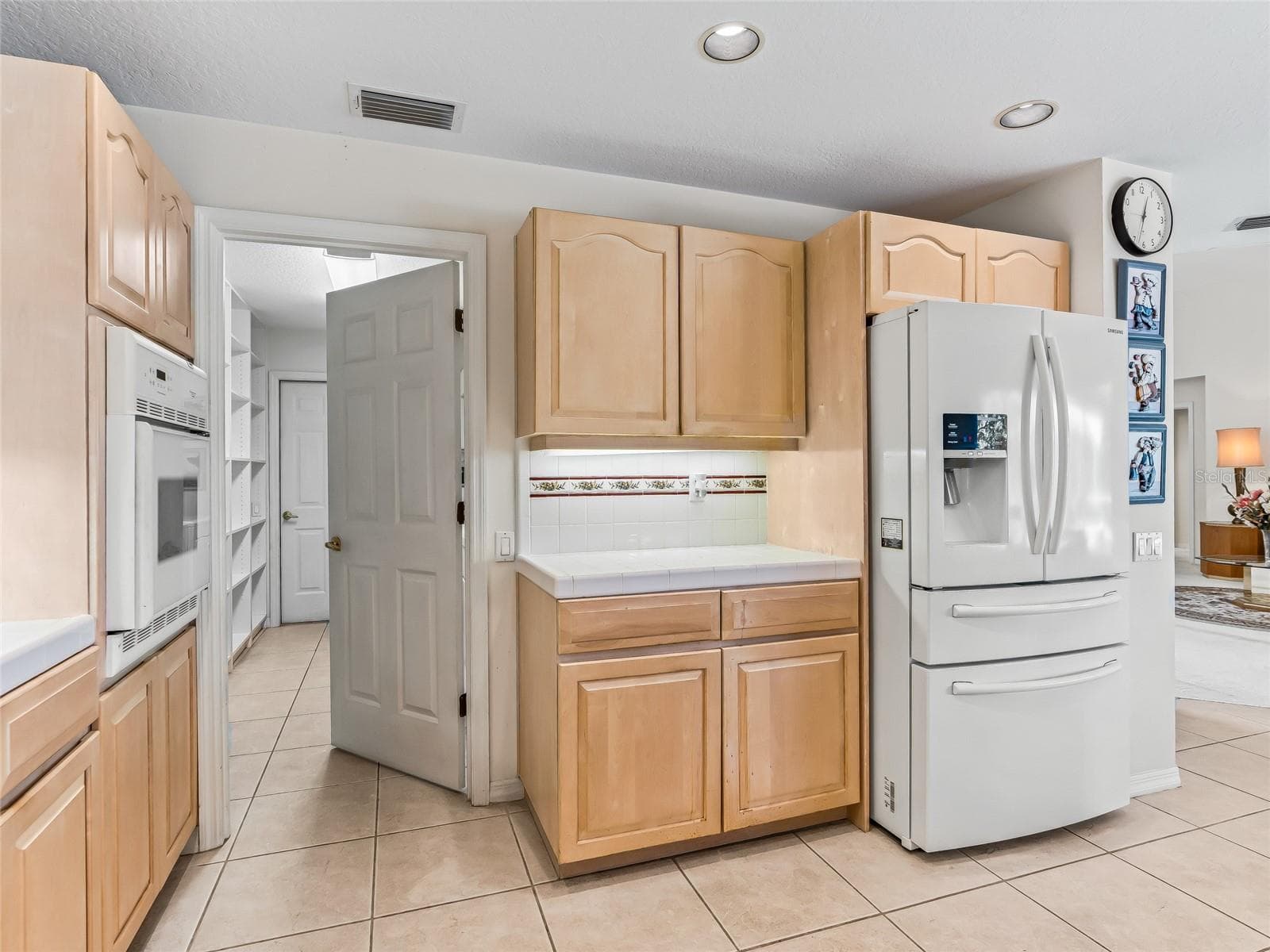 Door to Laundry room from kitchen - 5321 GREENS DR, LADY LAKE