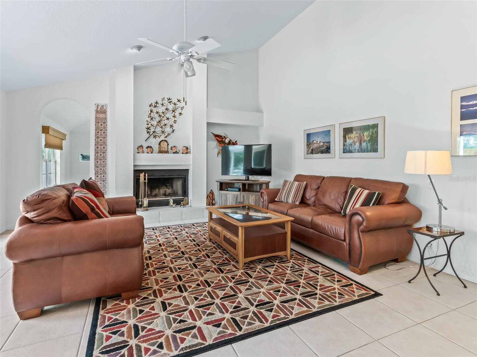 Family room has a fireplace - 5321 GREENS DR, LADY LAKE