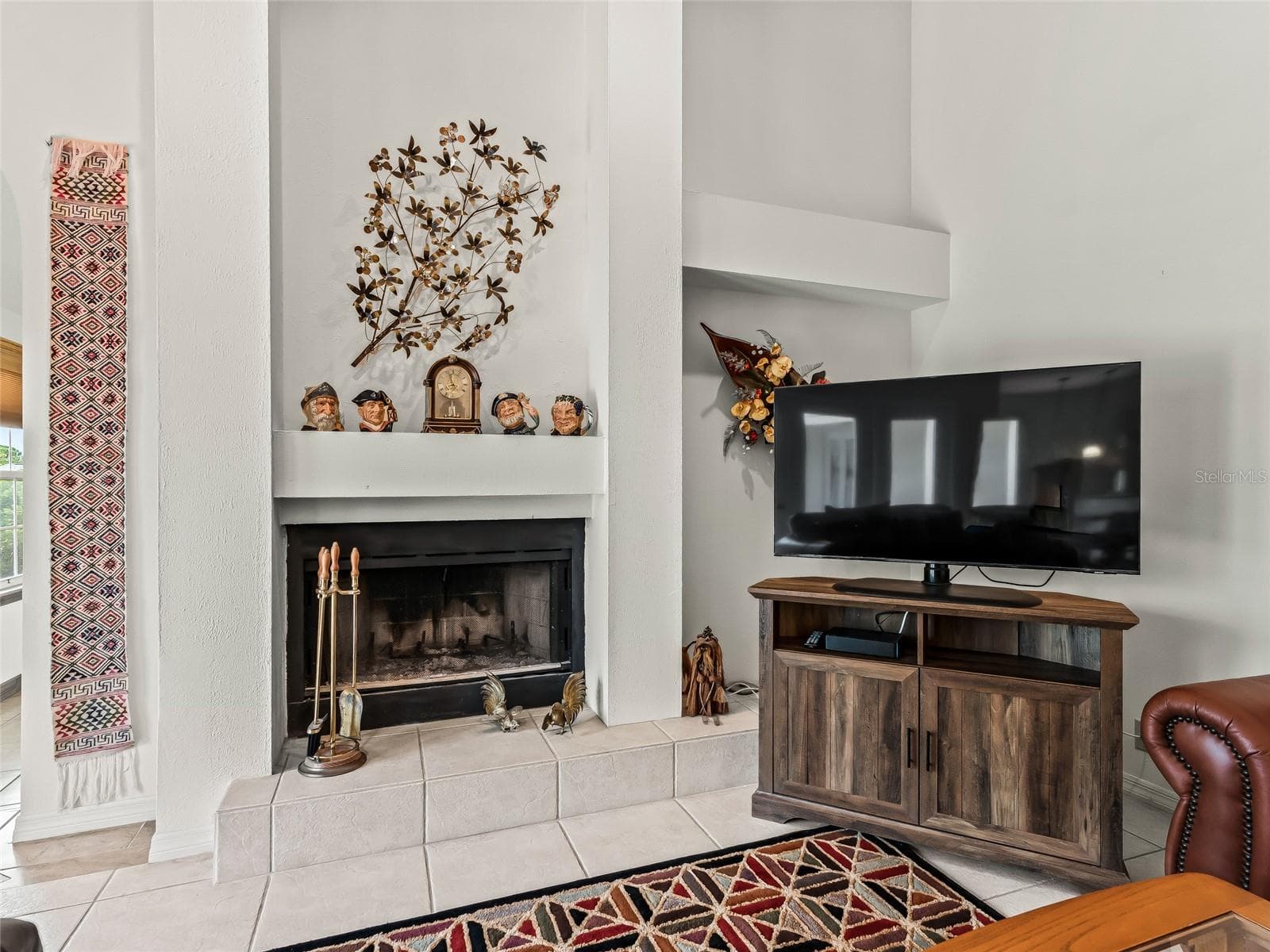 Accents shelf near fireplace - 5321 GREENS DR, LADY LAKE