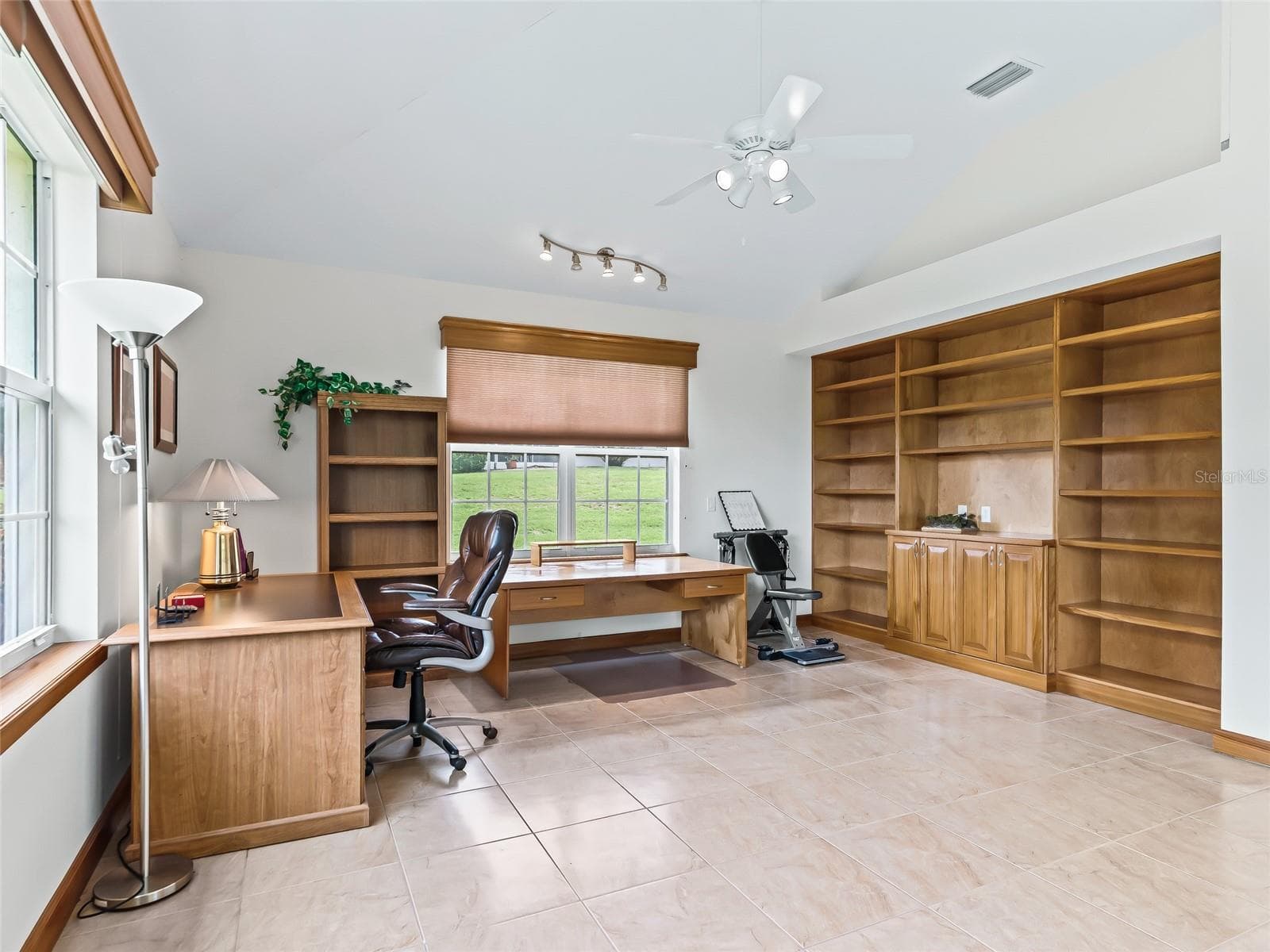 Nice built in cabinets in Bonus room - 5321 GREENS DR, LADY LAKE