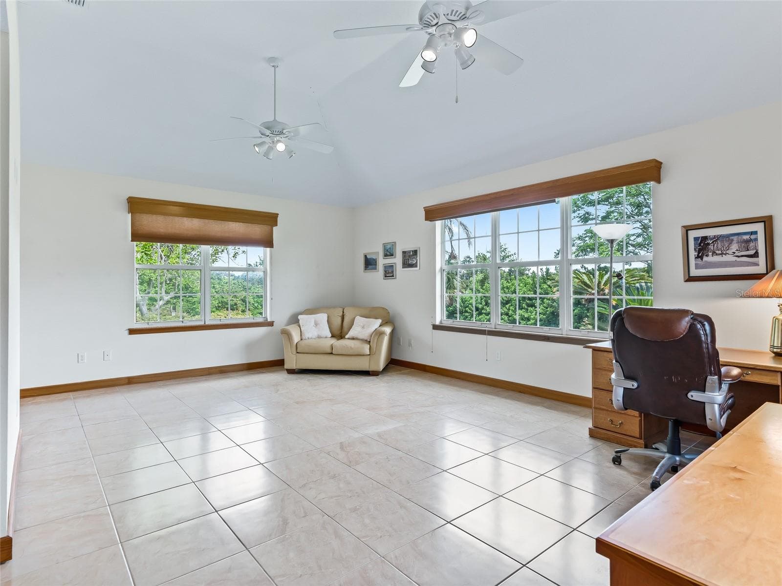 Large windows and ez care tile floor - 5321 GREENS DR, LADY LAKE