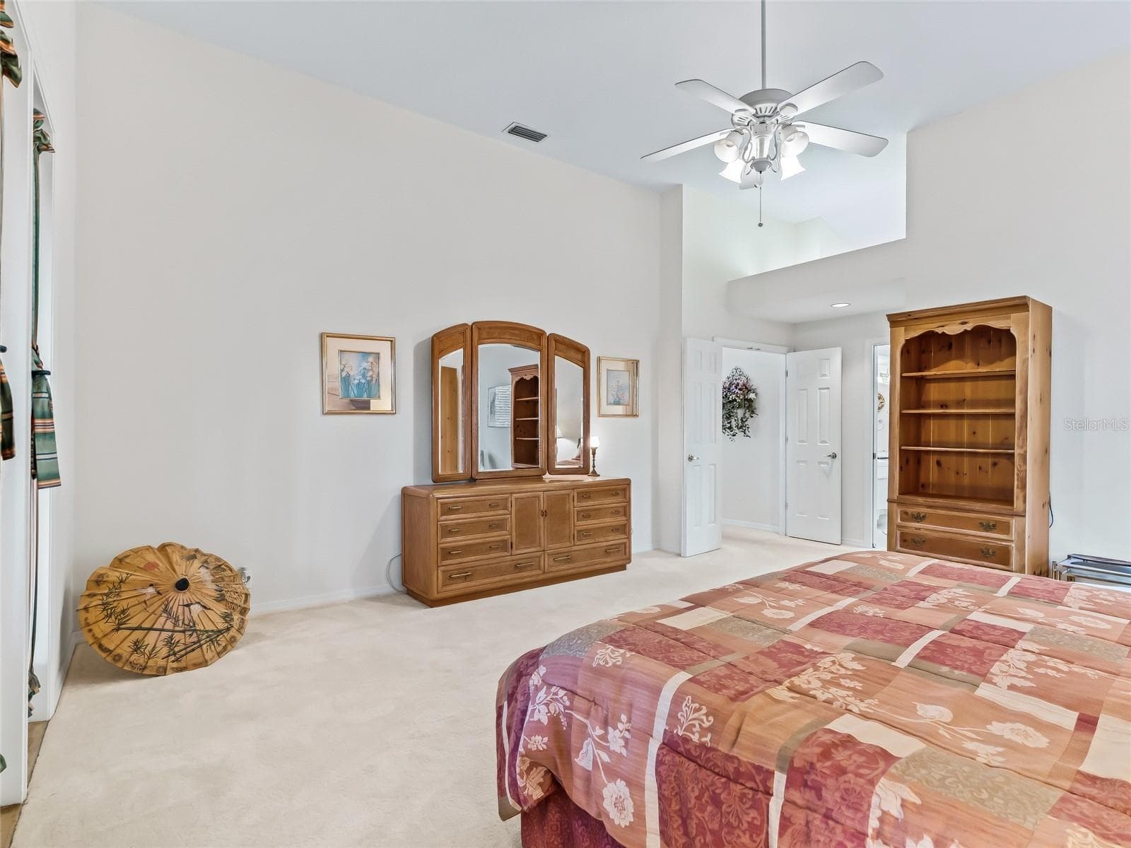 Primary bedroom has fan - 5321 GREENS DR, LADY LAKE
