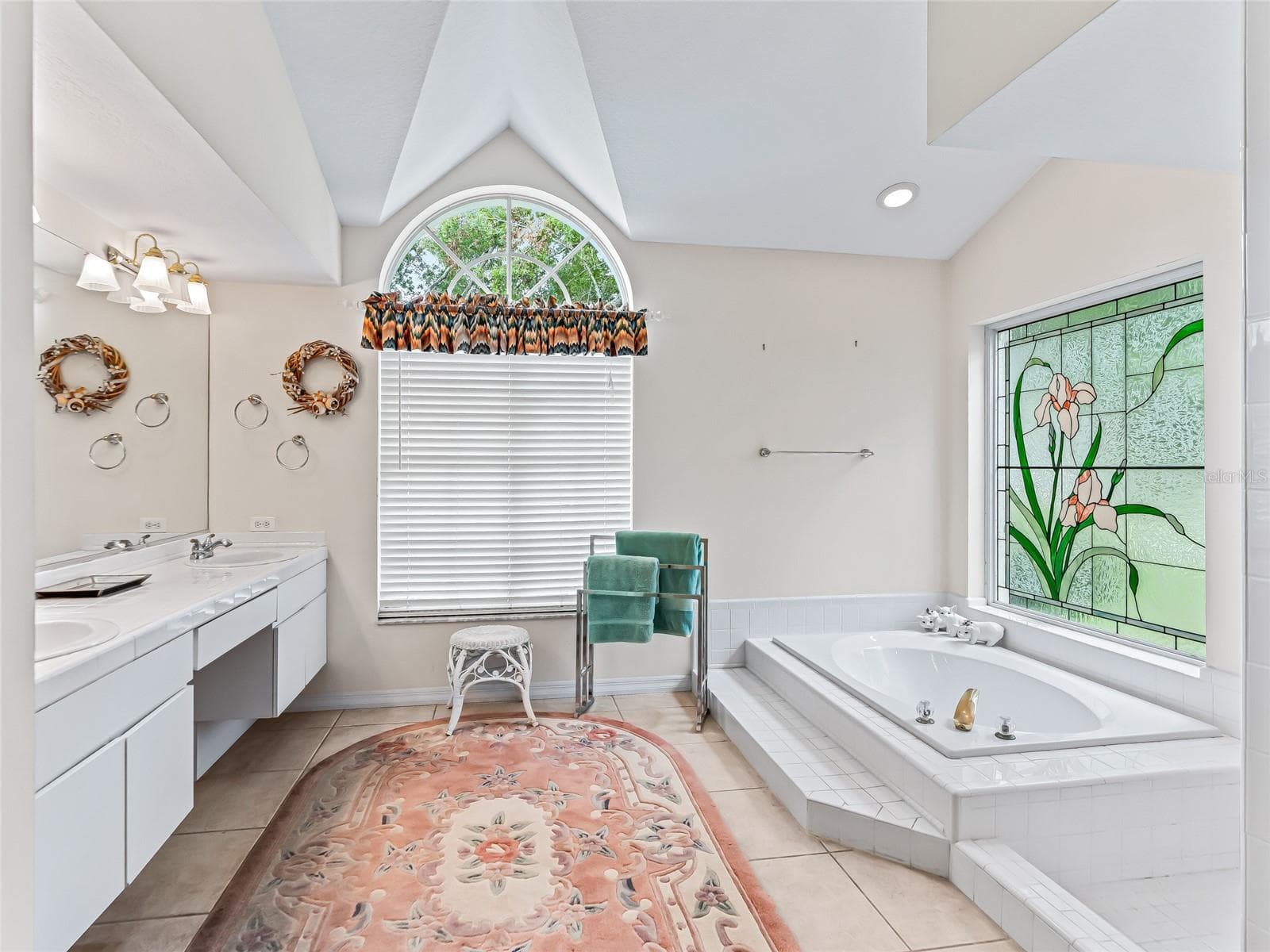 Primary bath has stained glass accent window - 5321 GREENS DR, LADY LAKE