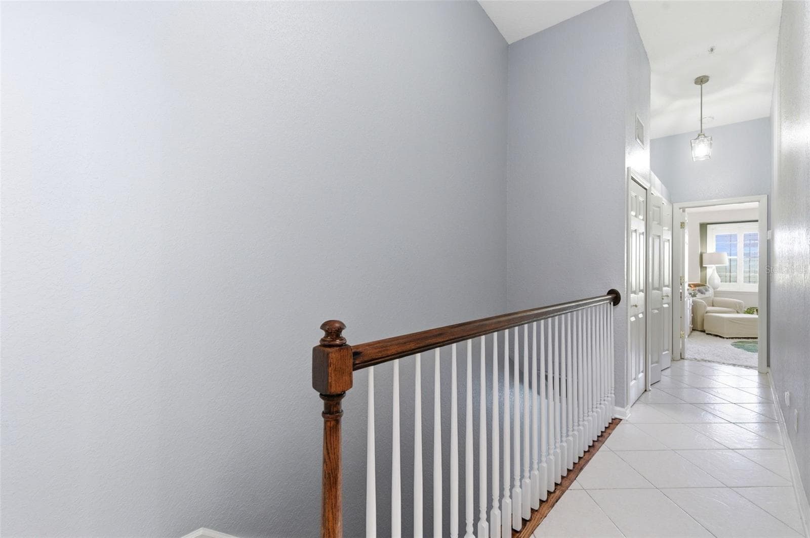 Hallway to primary suite and bedroom #3 - 117 BRENT CIR, OLDSMAR