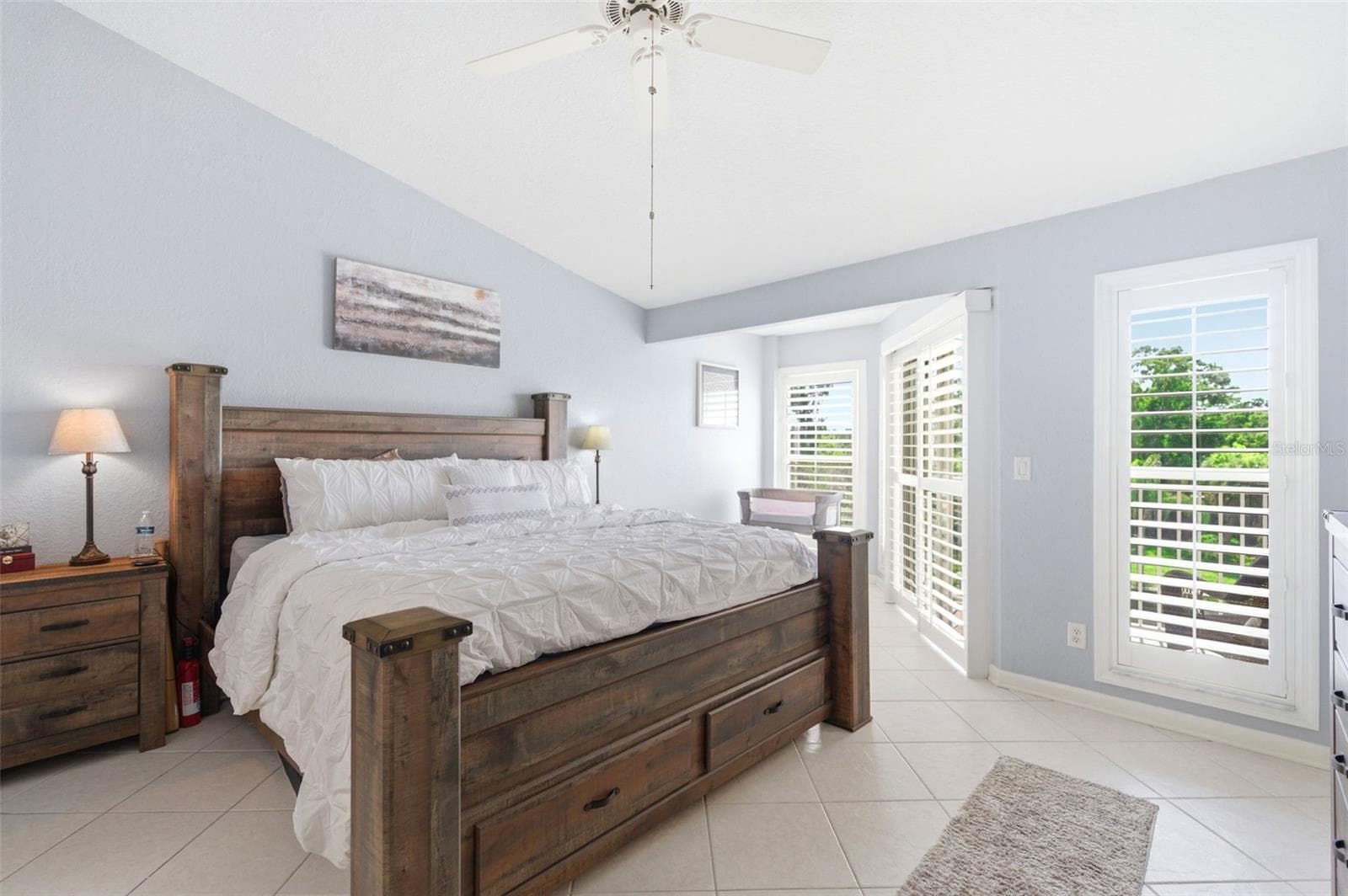 Primary suite with sky light, floor to ceiling windows and a private balcony - 117 BRENT CIR, OLDSMAR