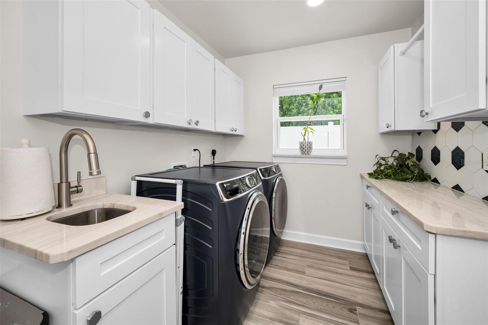 Utility Sink in Laundry Room w/ Folding area & storage Closet - 1620 SEA BREEZE DR, TARPON SPRINGS