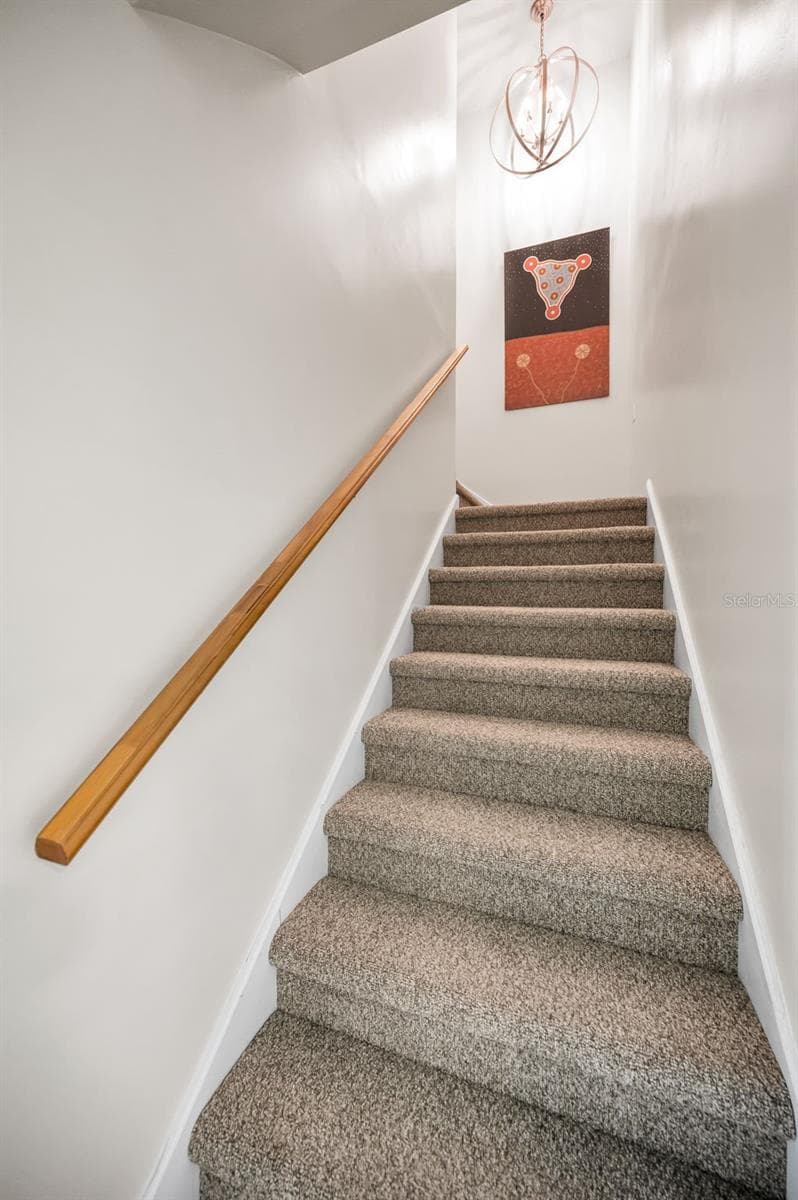 Stairway to the Primary Bedroom with a Balcony over looking the outstanding view - 1620 SEA BREEZE DR, TARPON SPRINGS