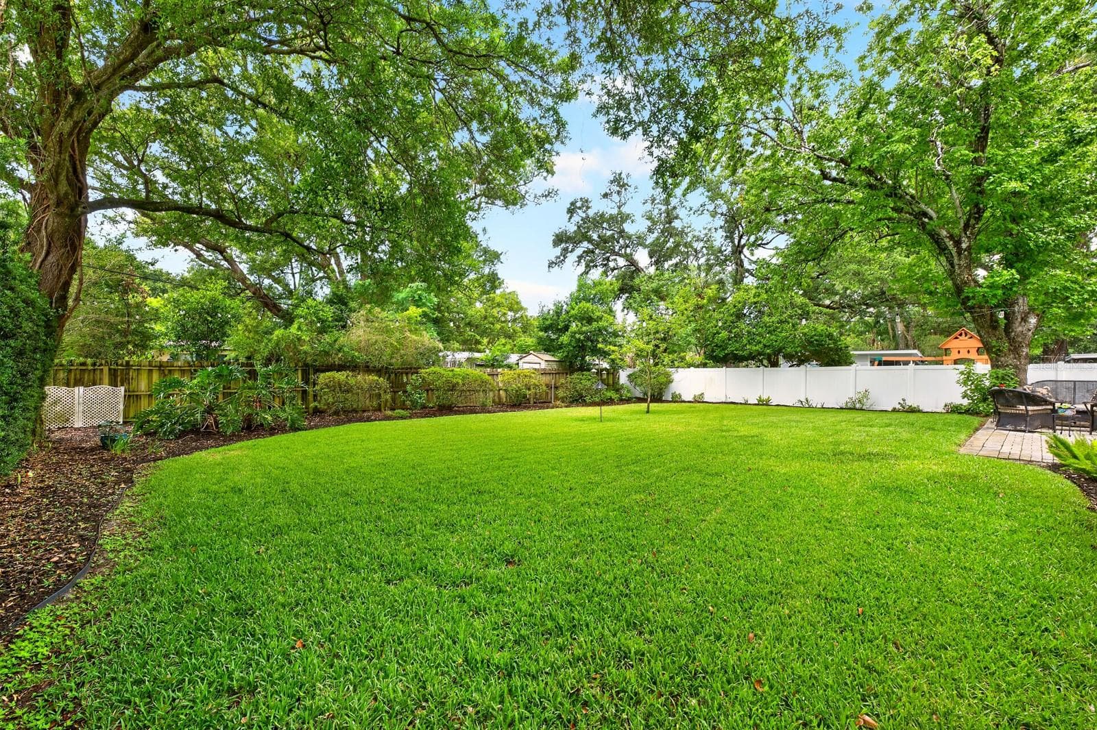 The SPACIOUS VINYL FENCED YARD offers privacy and endless possibilities. - 2706 HARGILL DR, ORLANDO