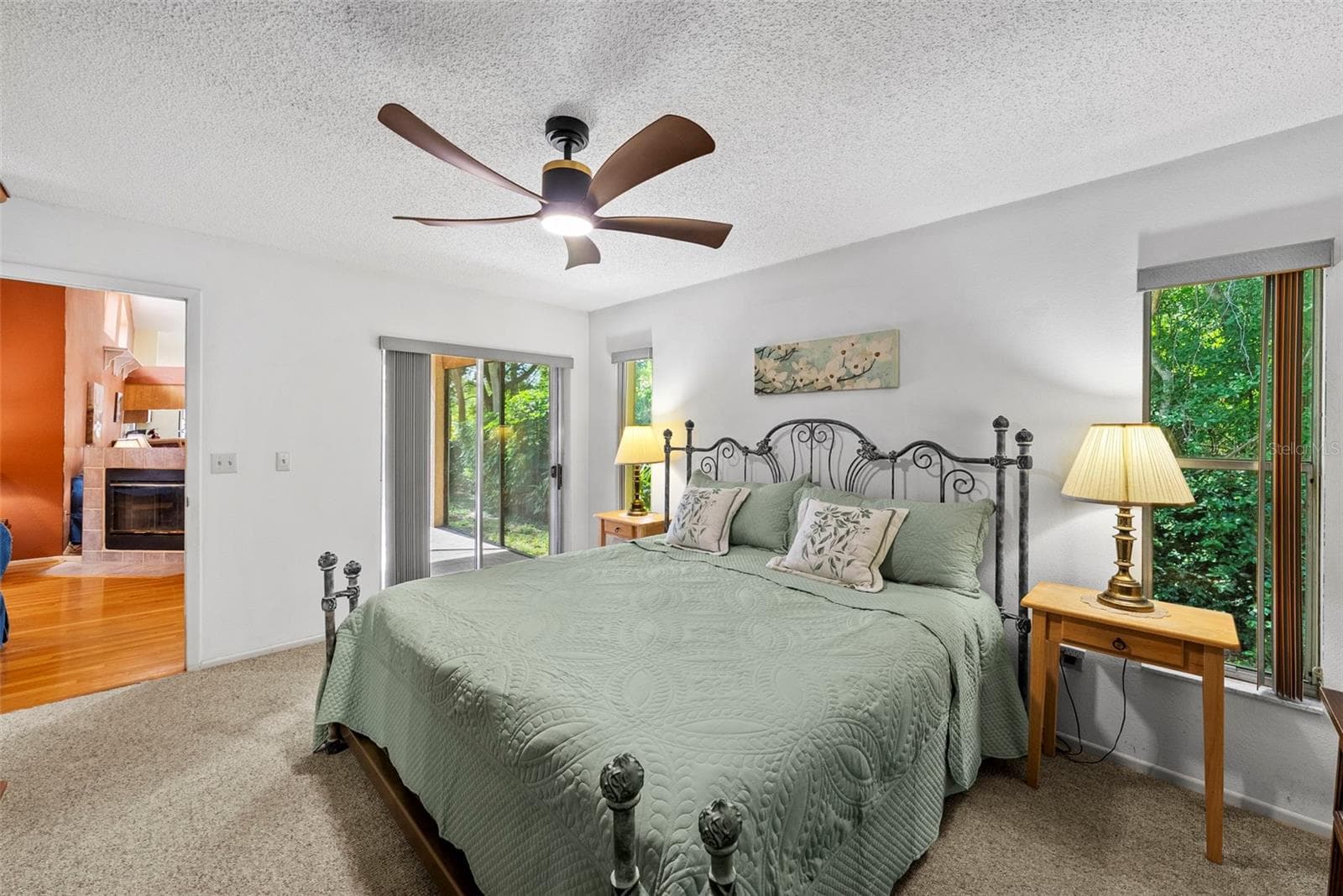 Primary bedroom with generous natural light and neutral finishes. - 8601 TWIN FARMS PL, TAMPA