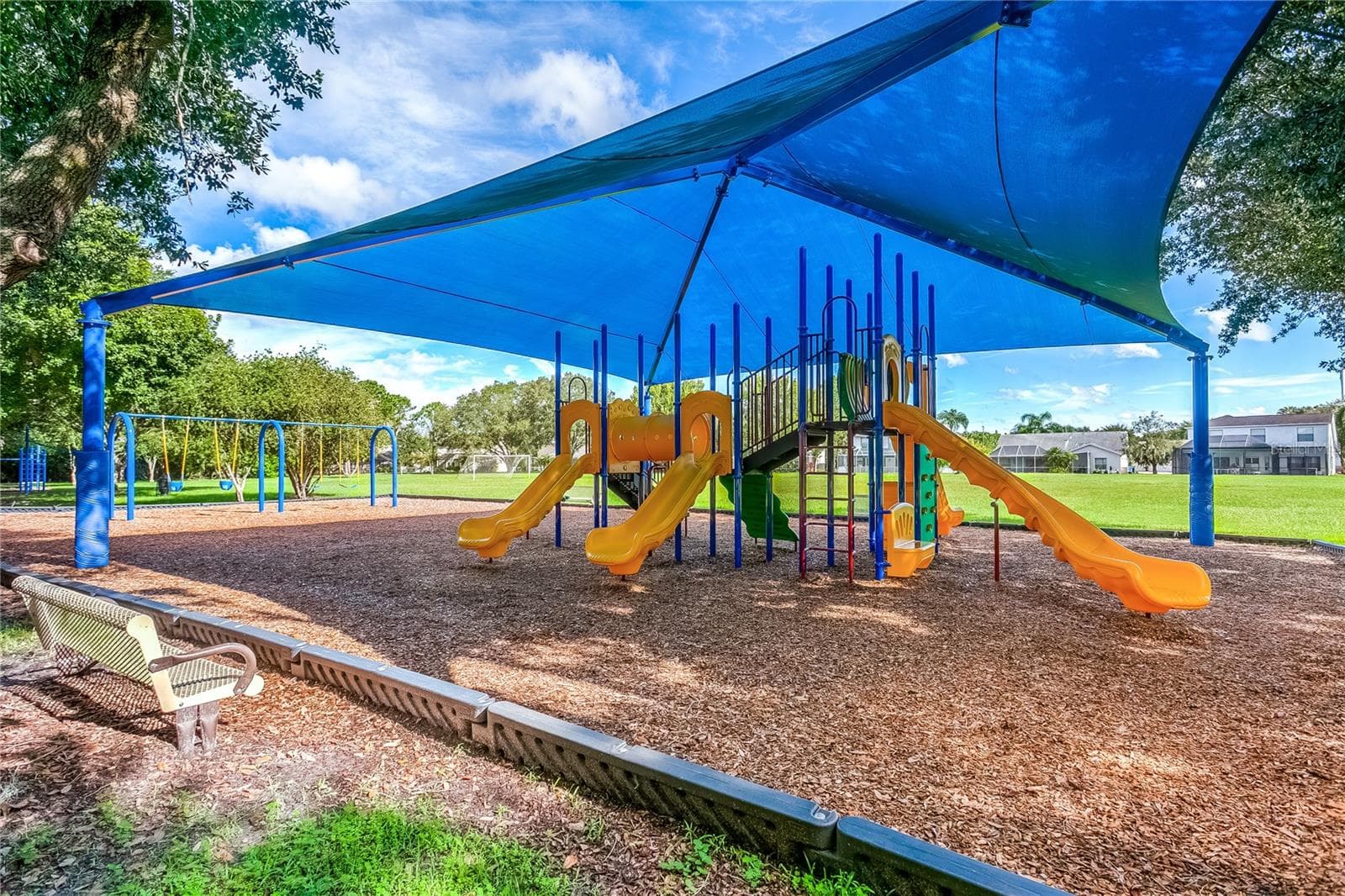 Covered playground area designed for year-round enjoyment. - 8601 TWIN FARMS PL, TAMPA