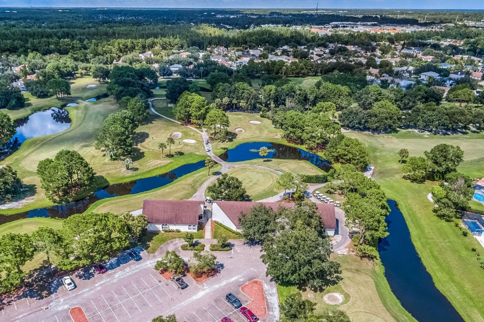 Aerial view of Countryway Golf Club and surrounding lakes. - 8601 TWIN FARMS PL, TAMPA