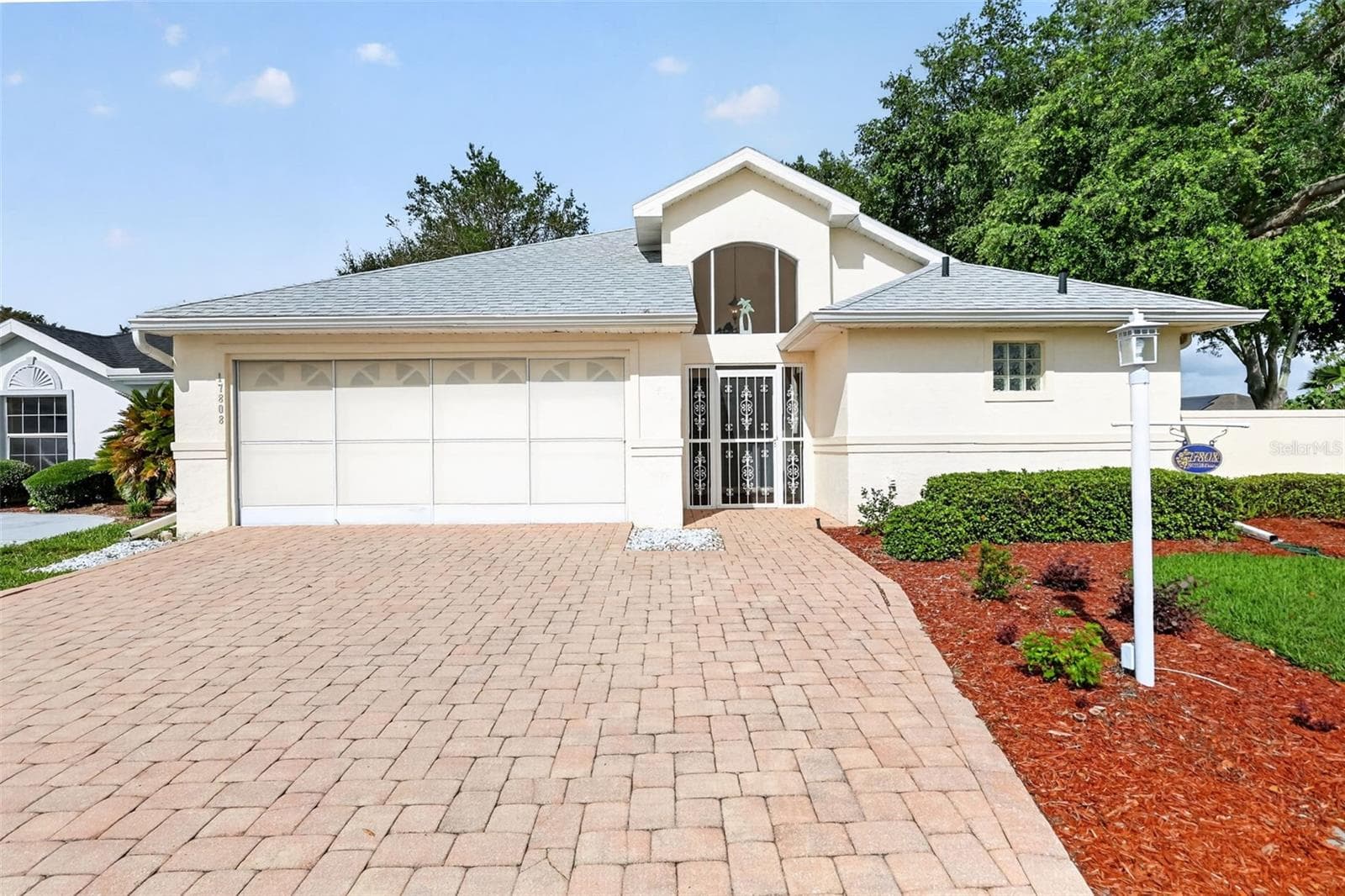 Front of home with paver drive way and side walk. - 17808 SE 115TH CT, SUMMERFIELD