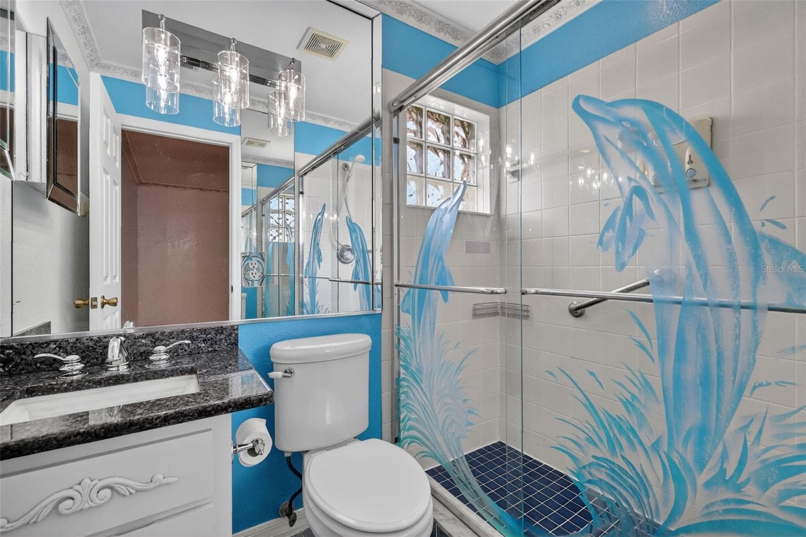 En suite bathroom with granite countertop and walk in shower. - 17808 SE 115TH CT, SUMMERFIELD