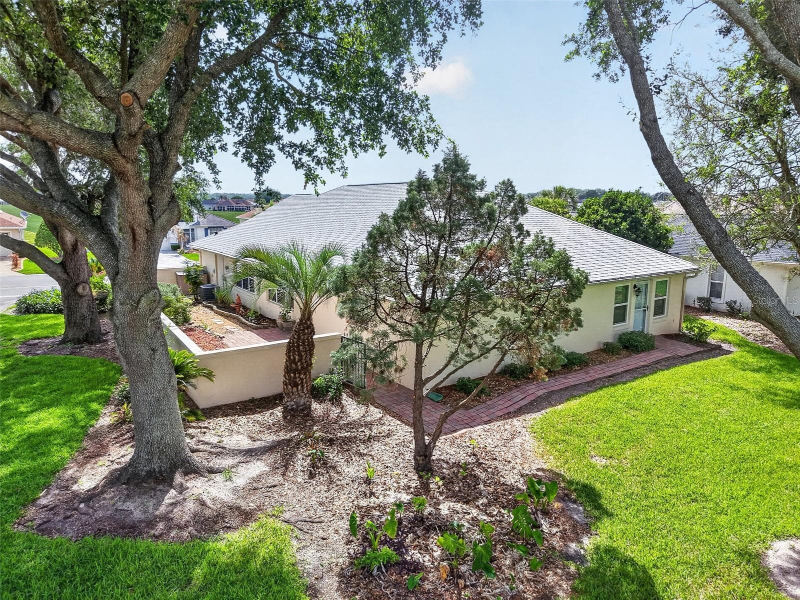 Mature trees provide refreshing shade and enhance the outdoor enjoyment of the property during the warmer months. - 17808 SE 115TH CT, SUMMERFIELD