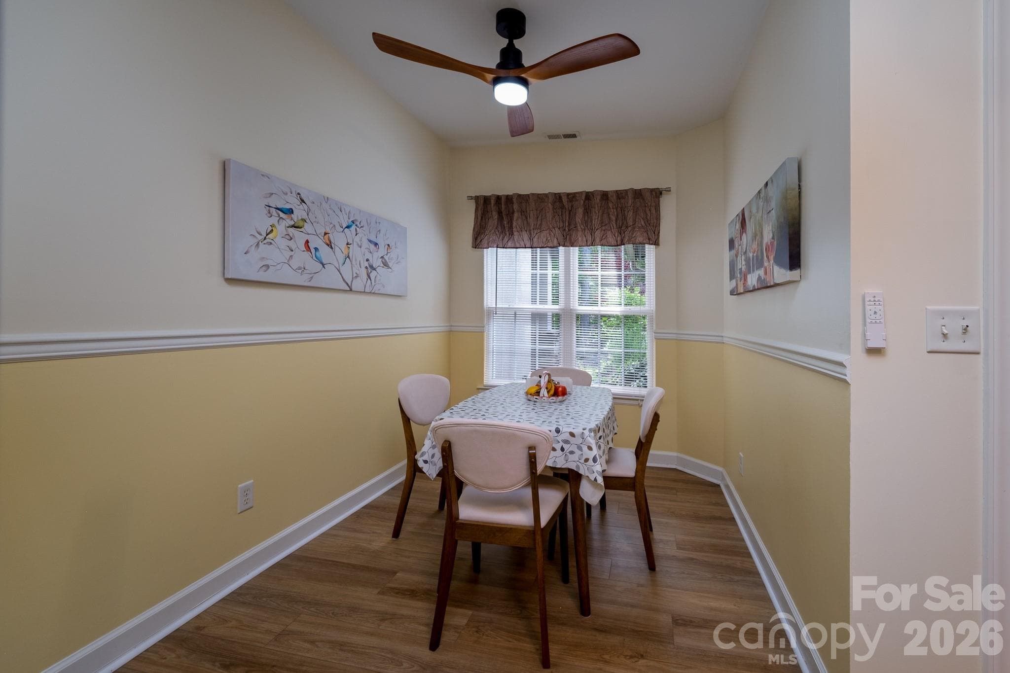 Dining Area / Flex Space – Bright dining area with wooded views, ideal for formal dining, casual meals, or flexible use as a sitting or office space. - 99 Ridgetop Circle, Brevard
