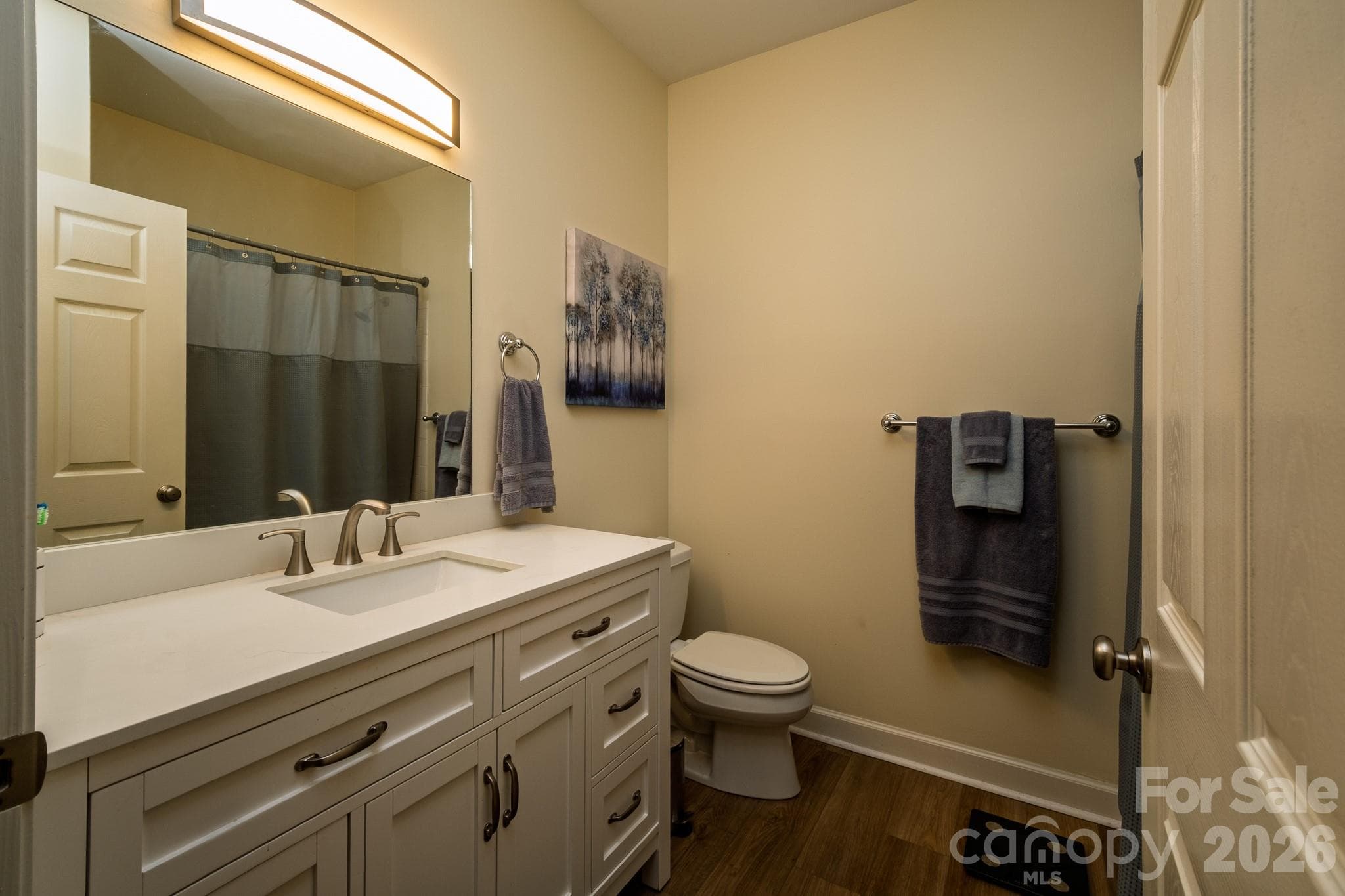 Updated Guest Bathroom – Nicely updated full bathroom featuring a modern vanity, updated fixtures, and tub/shower combination. - 99 Ridgetop Circle, Brevard