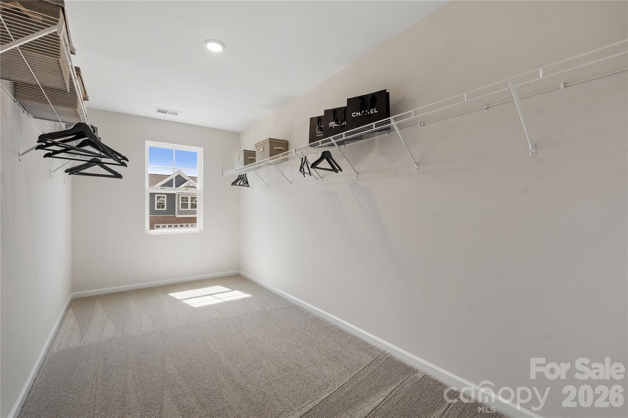 Representational photo *Model home*Primary closet - 5081 Puddle Pond Road, Indian Trail