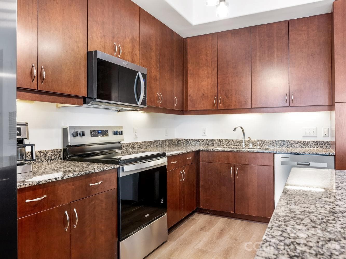 Kitchen with 2026 appliances and under-cabinet lighting - 4625 Piedmont Row Drive, Charlotte