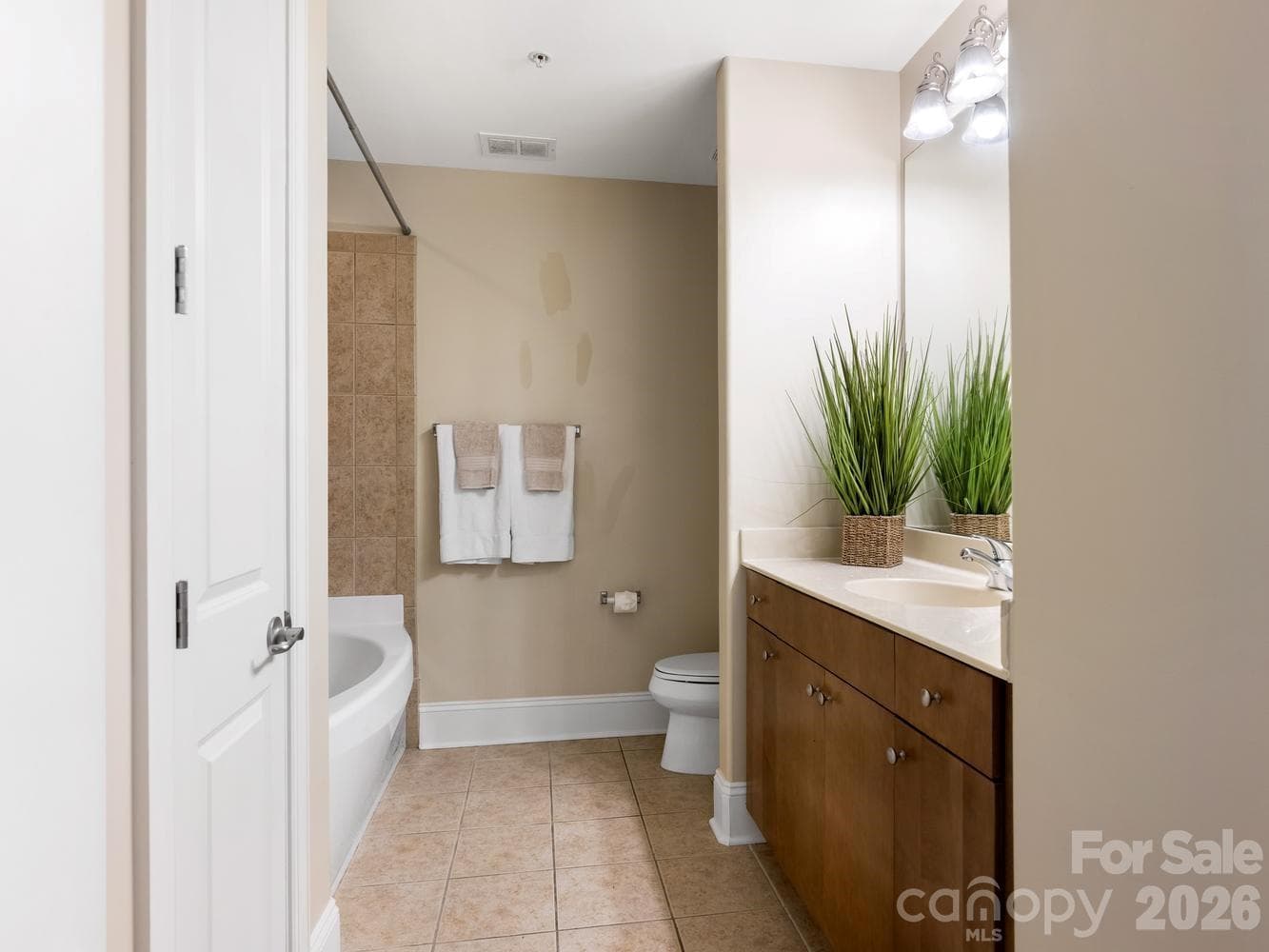 Hall bath with linen and laundry closets - 4625 Piedmont Row Drive, Charlotte