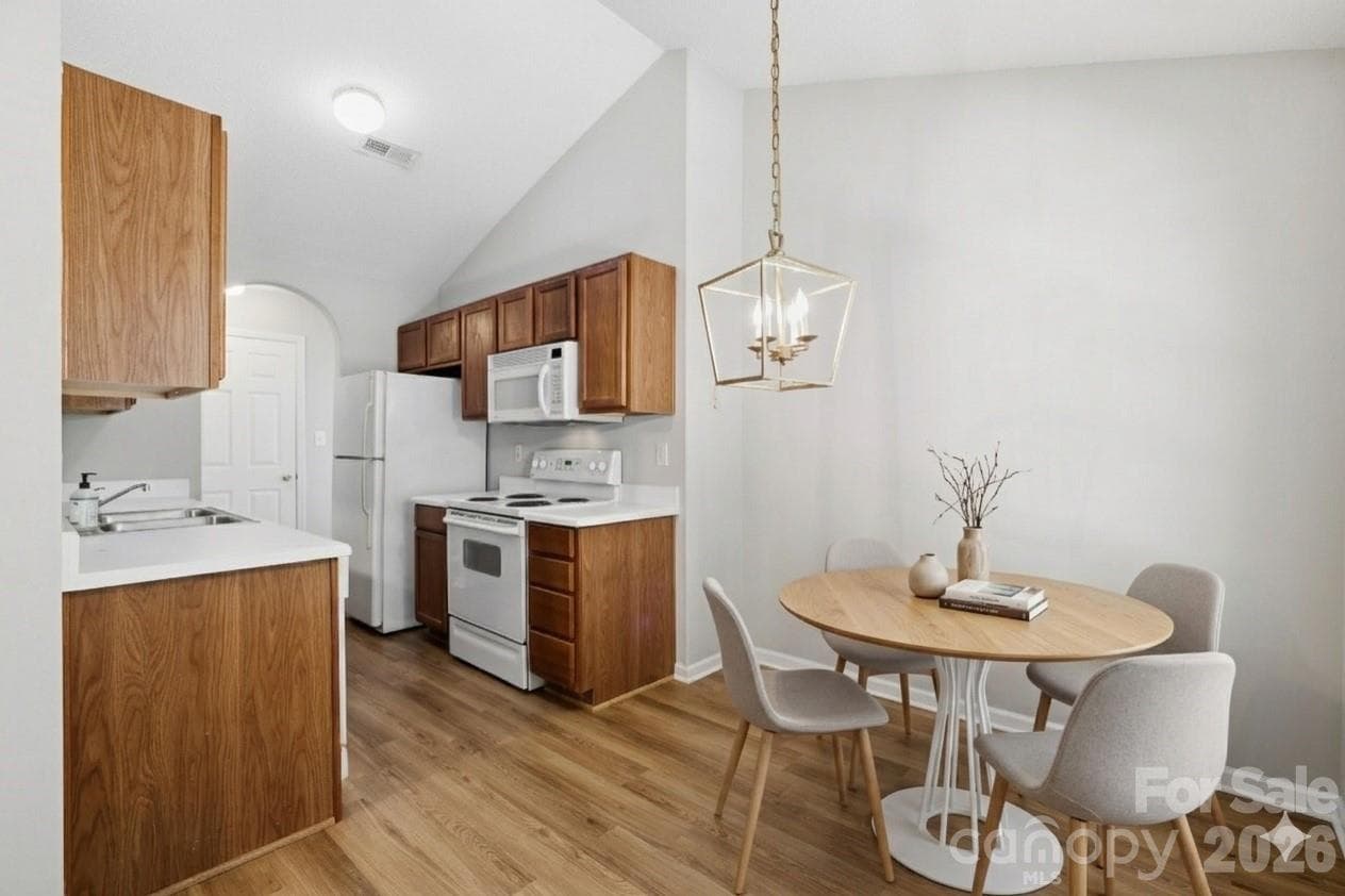Kitchen open to DiningVirtual Staging - 7616 Silver Arrow Drive, Charlotte