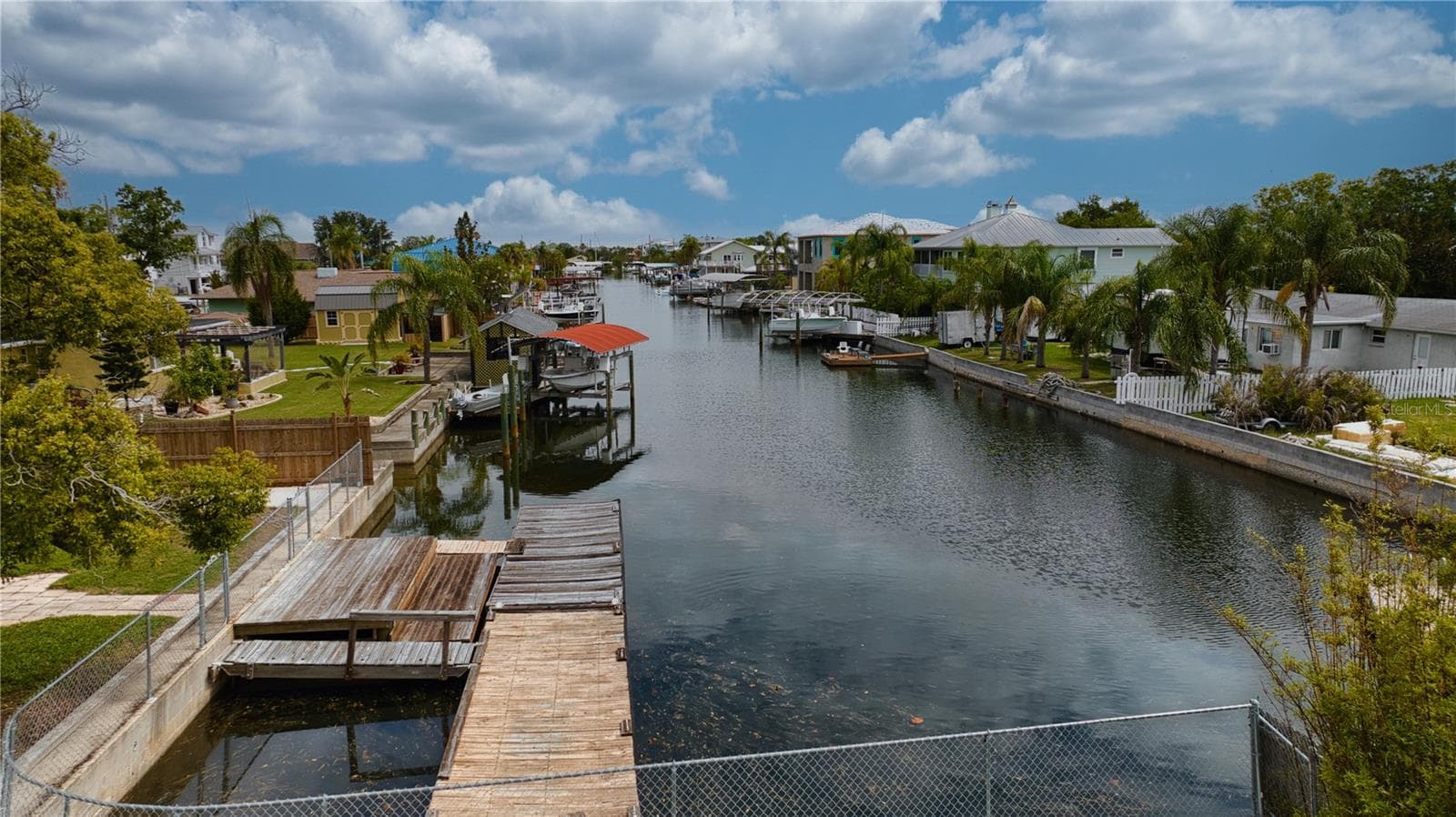 This home offers 110 feet of seawall with a 40 foot floating dock.  Upper stationary main dock rewooded in 2021. - 13724 COX AVE, HUDSON