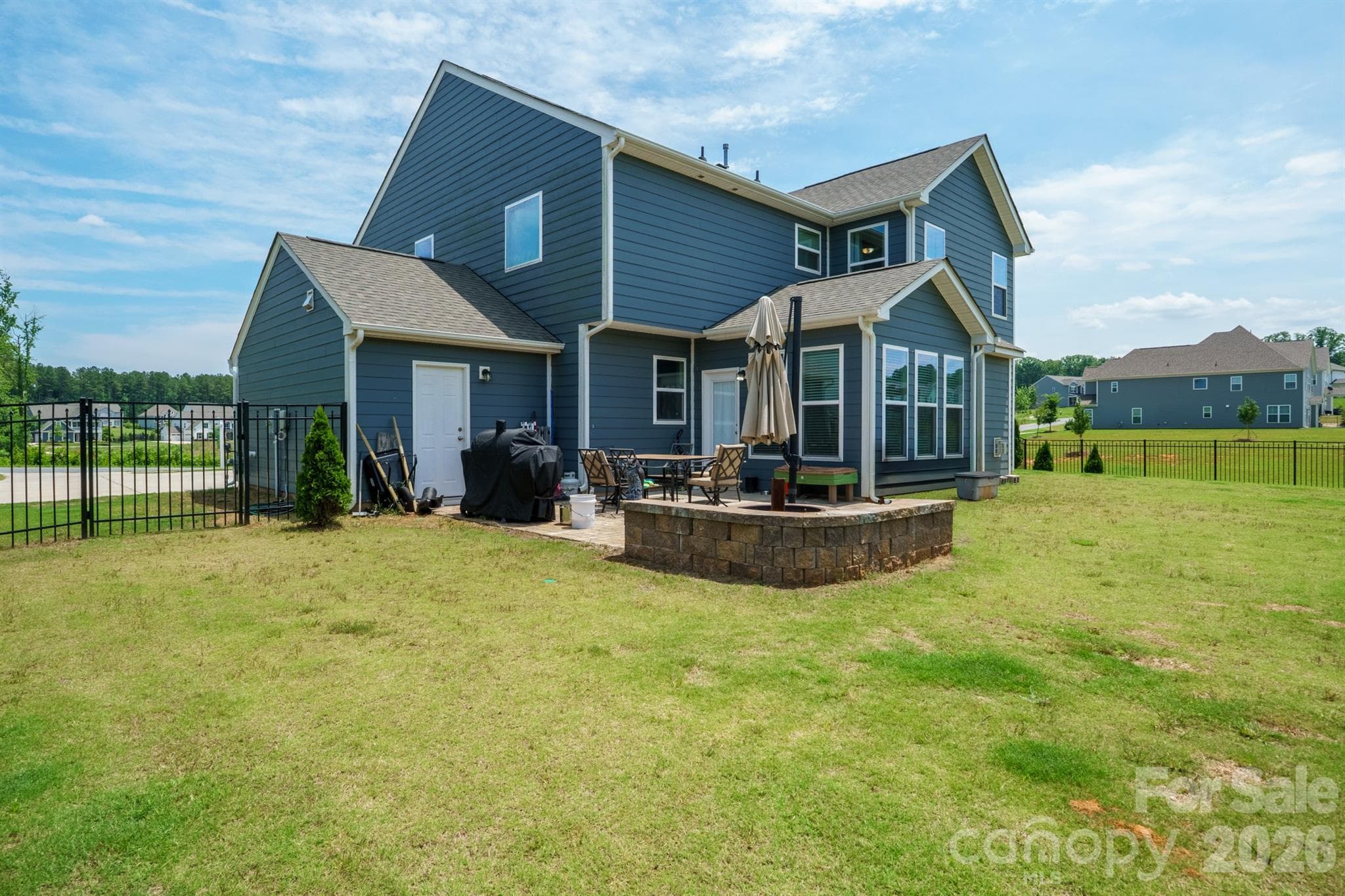 Fully Fenced Backyard with Paver Patio and Firepit - 282 Bouchard Drive, Waxhaw