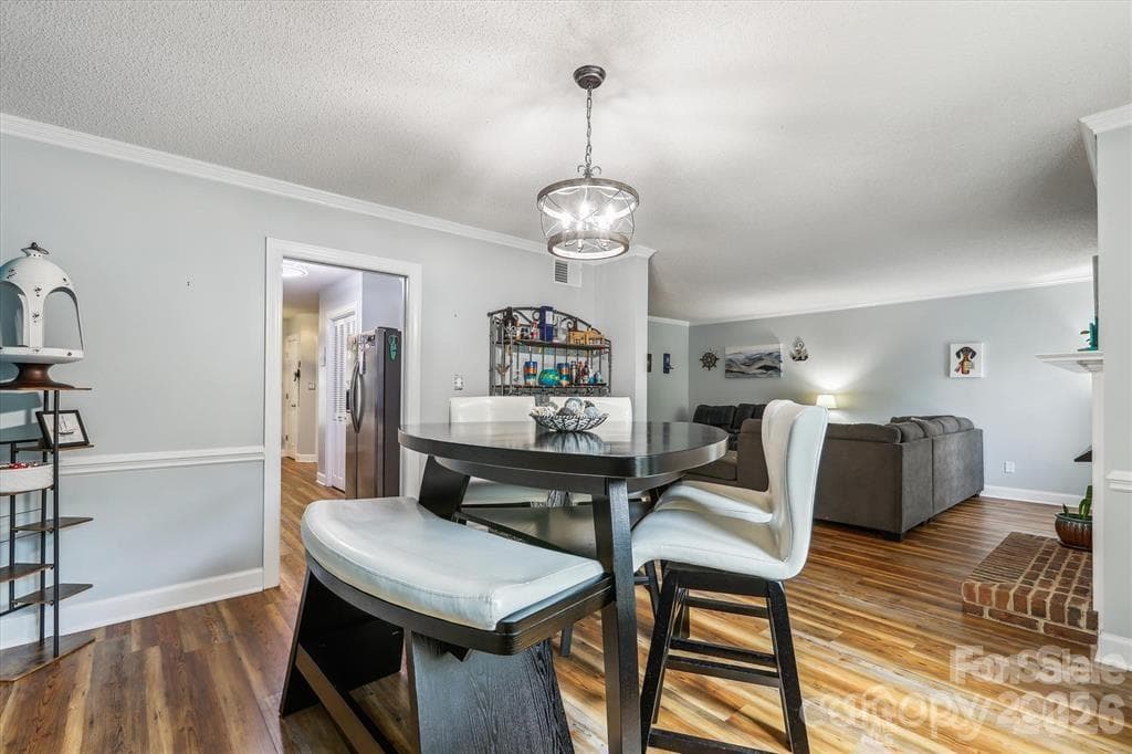 Enjoy seamless flow between the dining room and living area, making entertaining family and friends effortless - 806 Colony Oaks Drive, Monroe