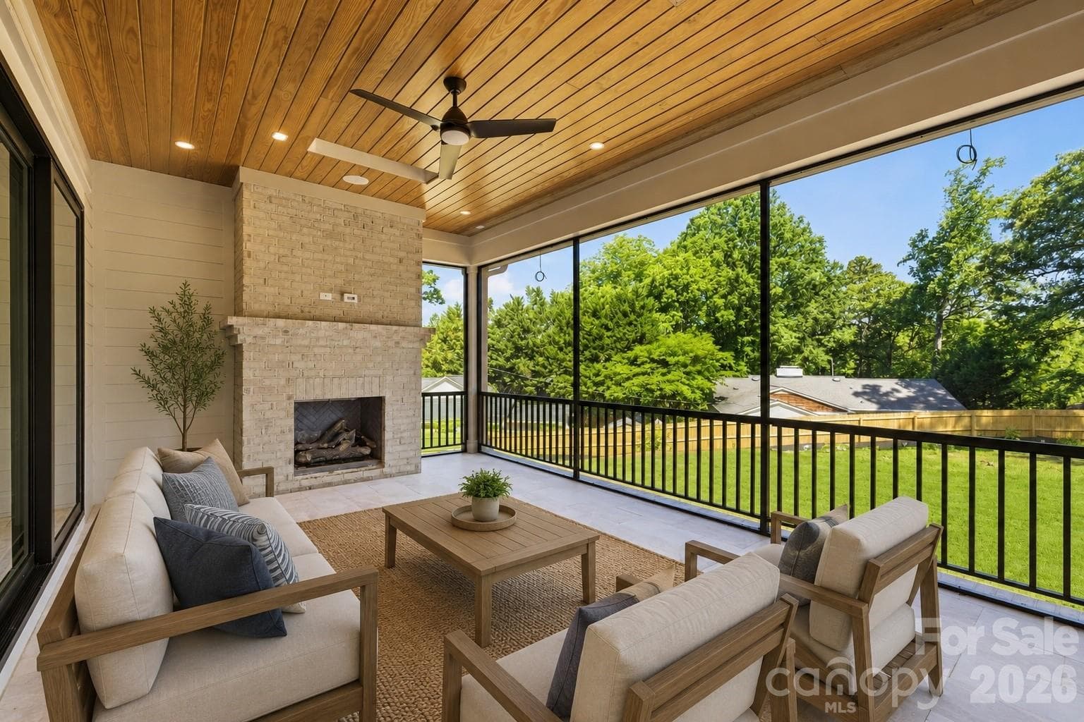 Covered and screened outdoor living with fireplace and two inset heaters for extended seasonal use - 125 Randstone Court, Charlotte