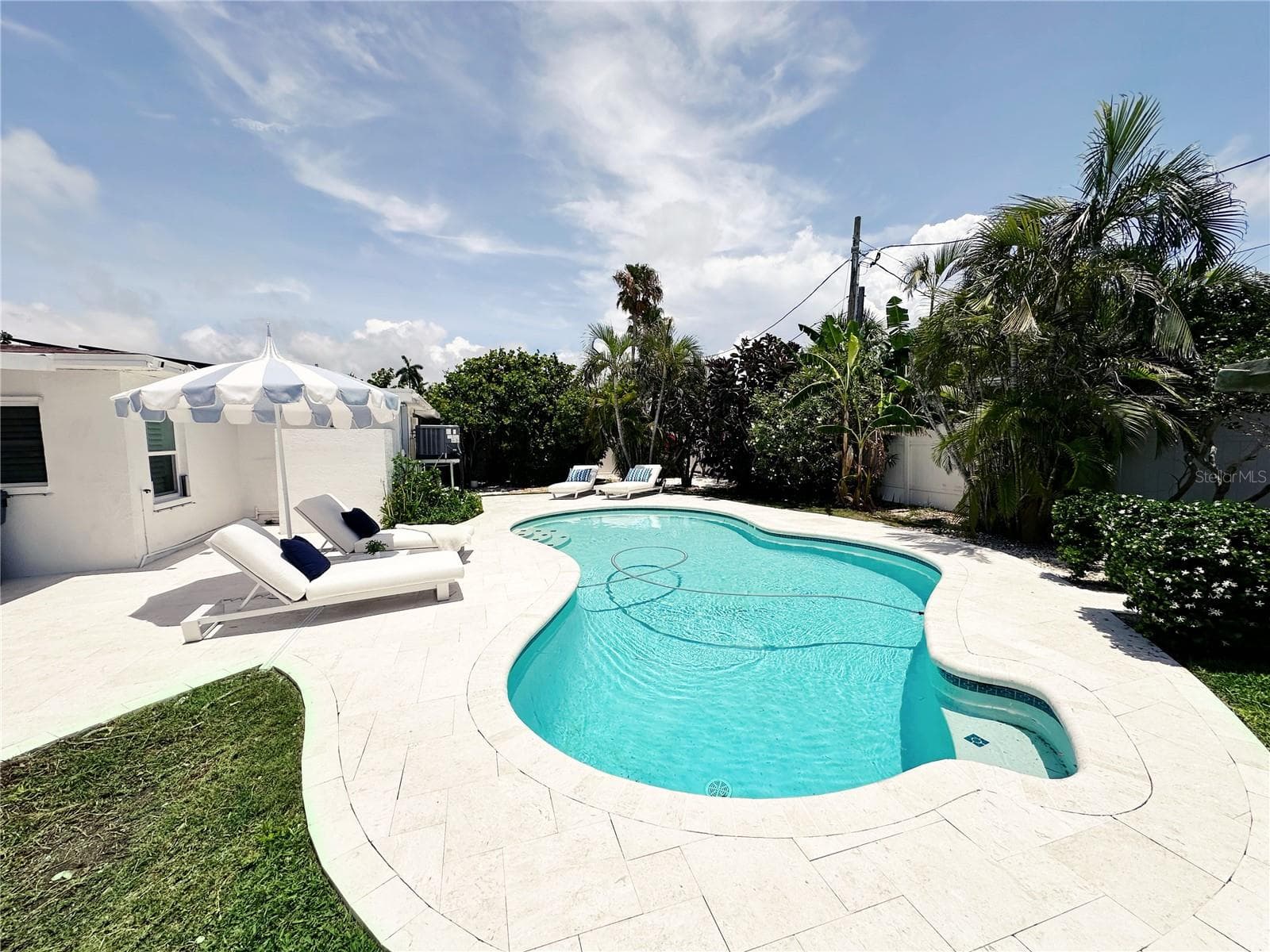 Pool area with pool sweeper - 155 112TH AVE #A, TREASURE ISLAND