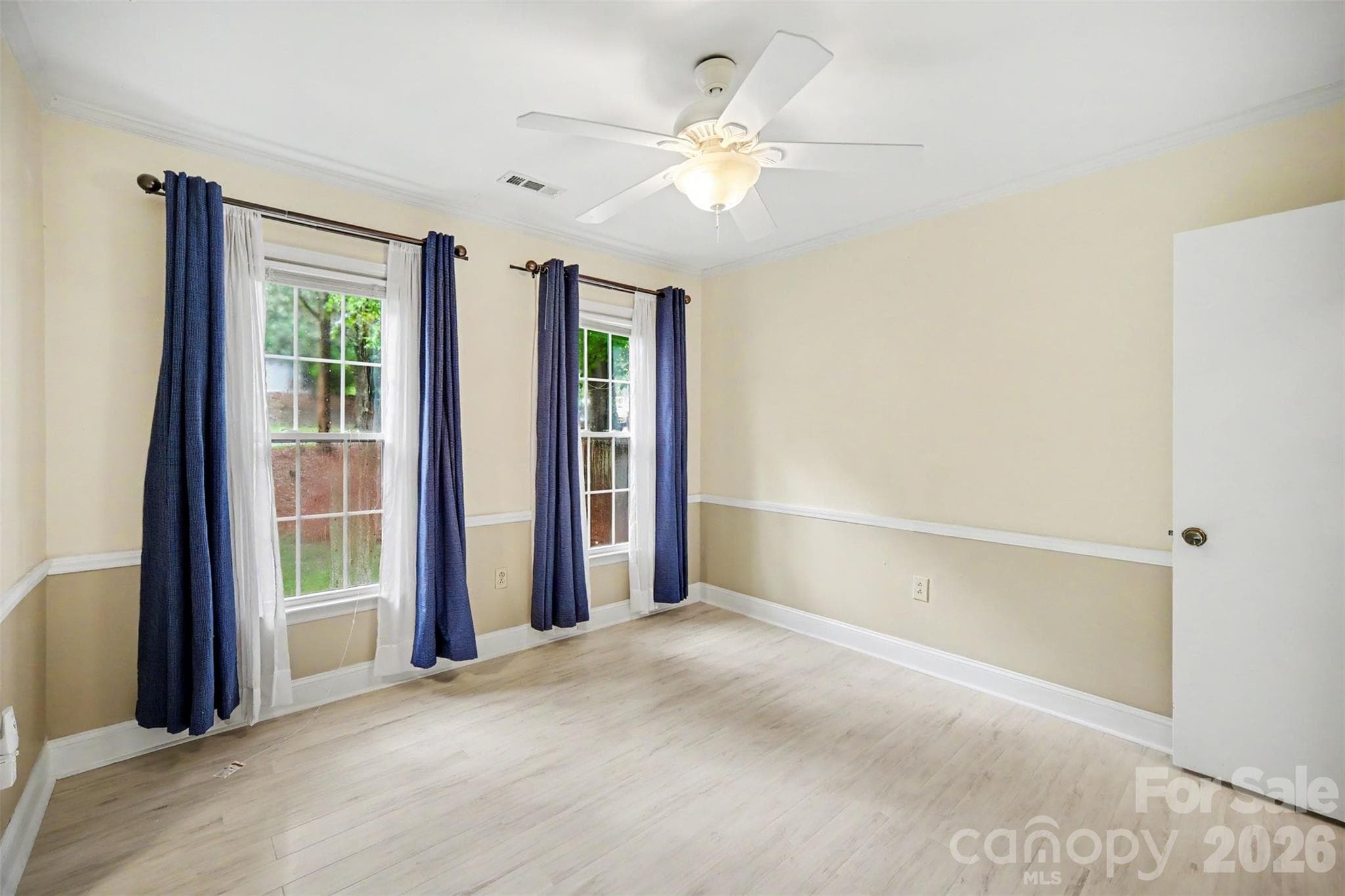 Dining Room and Living Room feature Elegant Chair Rail Molding - 8644 Kirchenbaum Drive, Charlotte