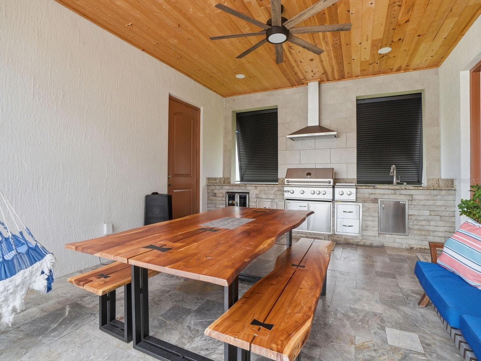 Breezeway entertainment area between the home and garage. - 9448 MERE PKWY, ORLANDO